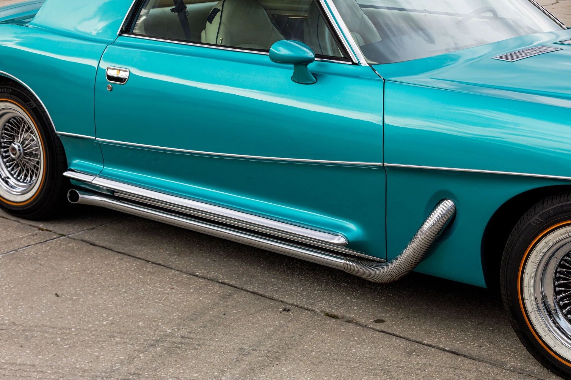 Right side of a 1978 Stutz, showing off its simulated running boards and fake side exhaust pipes