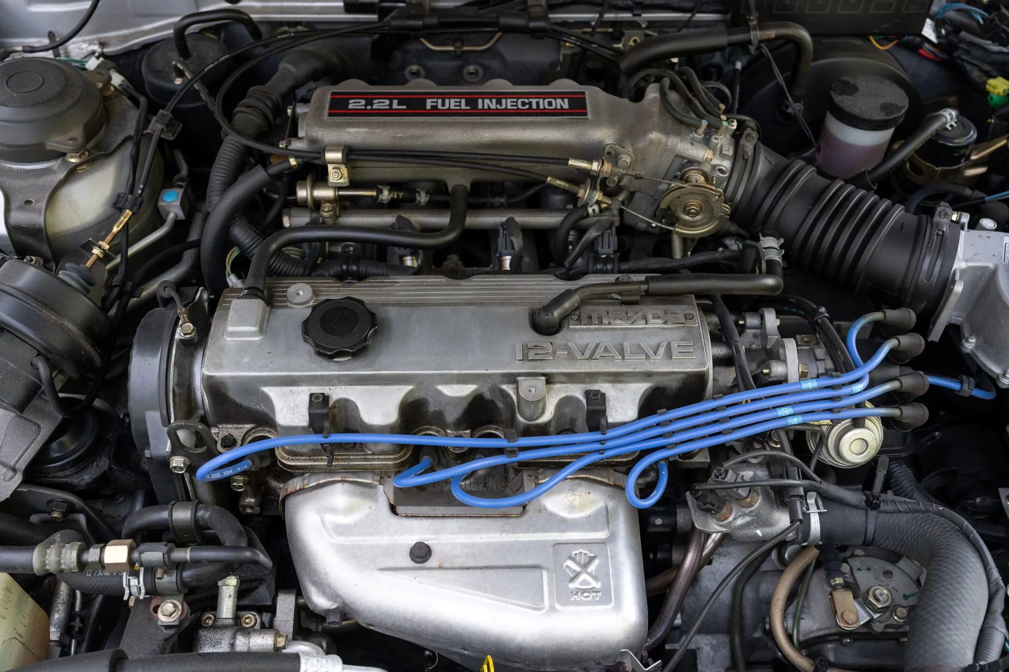 1991 Mazda MX-6 LX: In An Alternate Universe, This Could Have Been The Mustang Notchback 5 Engine compartment of 1991 Mazda MX-6 LX with 2.2-liter four cylinder
