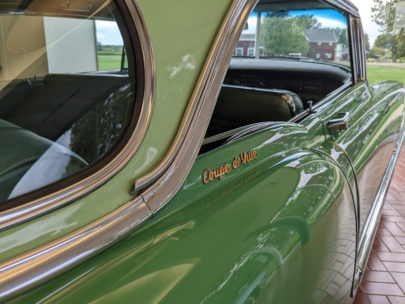 1955 Cadillac Coupe deVille C-pilar and gold nameplate