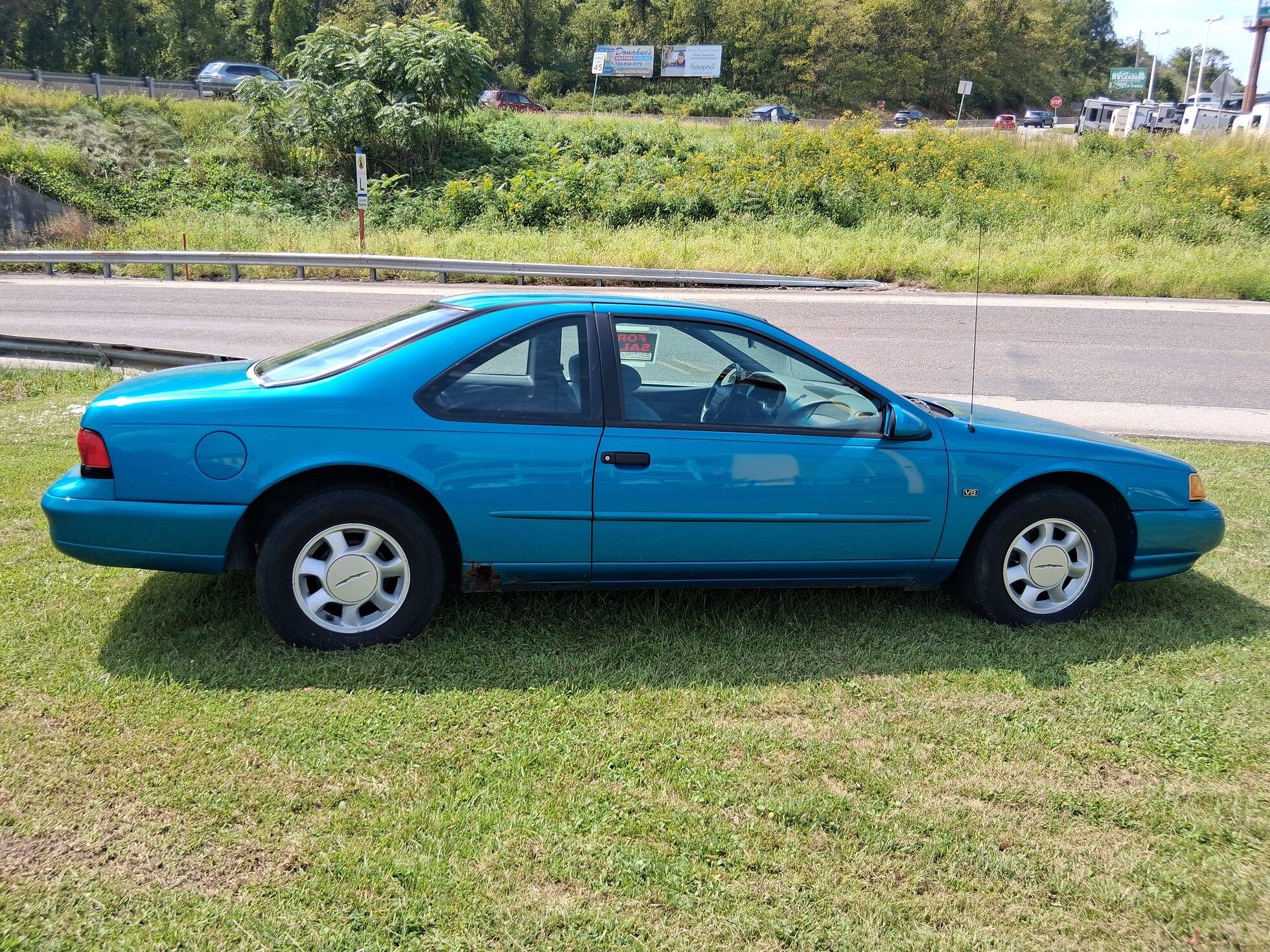 1994 Ford Thunderbird LX: As Teal As You Remember It, But A Little Rustier 6 Passenger side profile of teal 1994 Ford Thunderbird