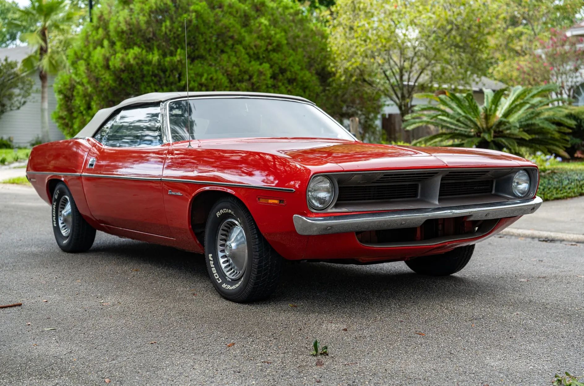 Passenger front 3q picture of red 1970 Plymouth Barracuda Convertible parked in the street