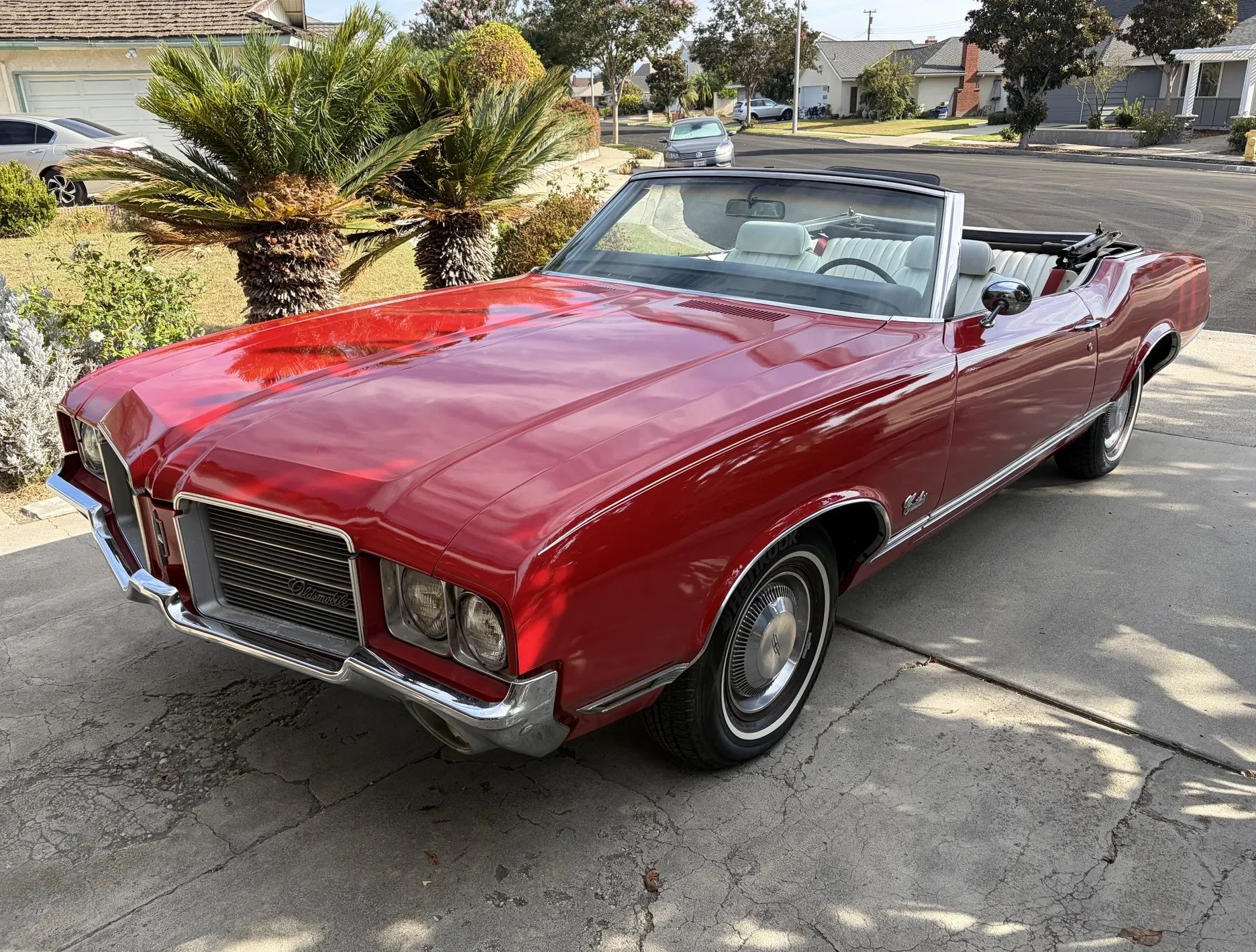 1971 Oldsmobile Cutlass Supreme Convertible: A Solid Driver With Only 82,000 Miles 1 Driver front 3q image of red 1971 Oldsmobile Cutlass Supreme Convertible parked in a driveway