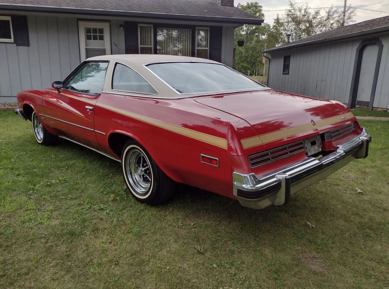 1975 Buick Century Hardtop Coupe: A Low-Mileage Original Example Of Why The Colonnade Actually Looked Pretty Good 7 Driver rear 3q picture of red 1975 Buick Century parked on a lawn in front of a house