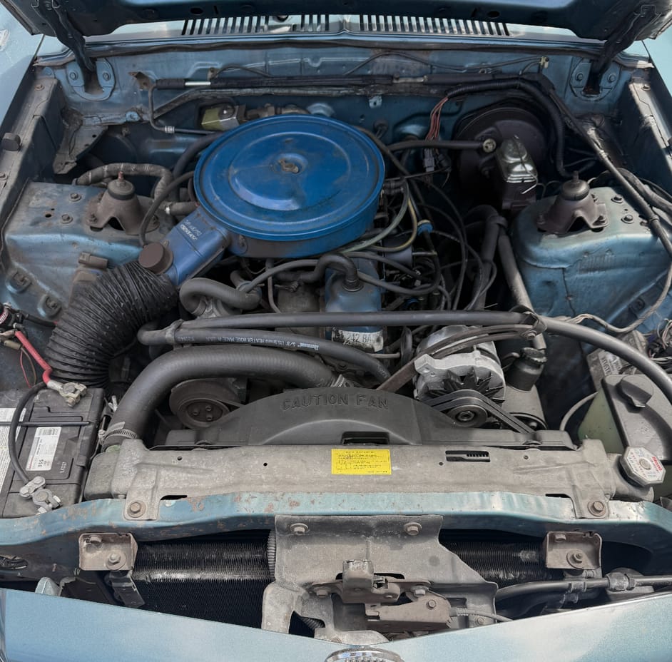 Engine compartment of 1976 Mercury Monarch Ghia with 250-cubic-inch six-cylinder engine
