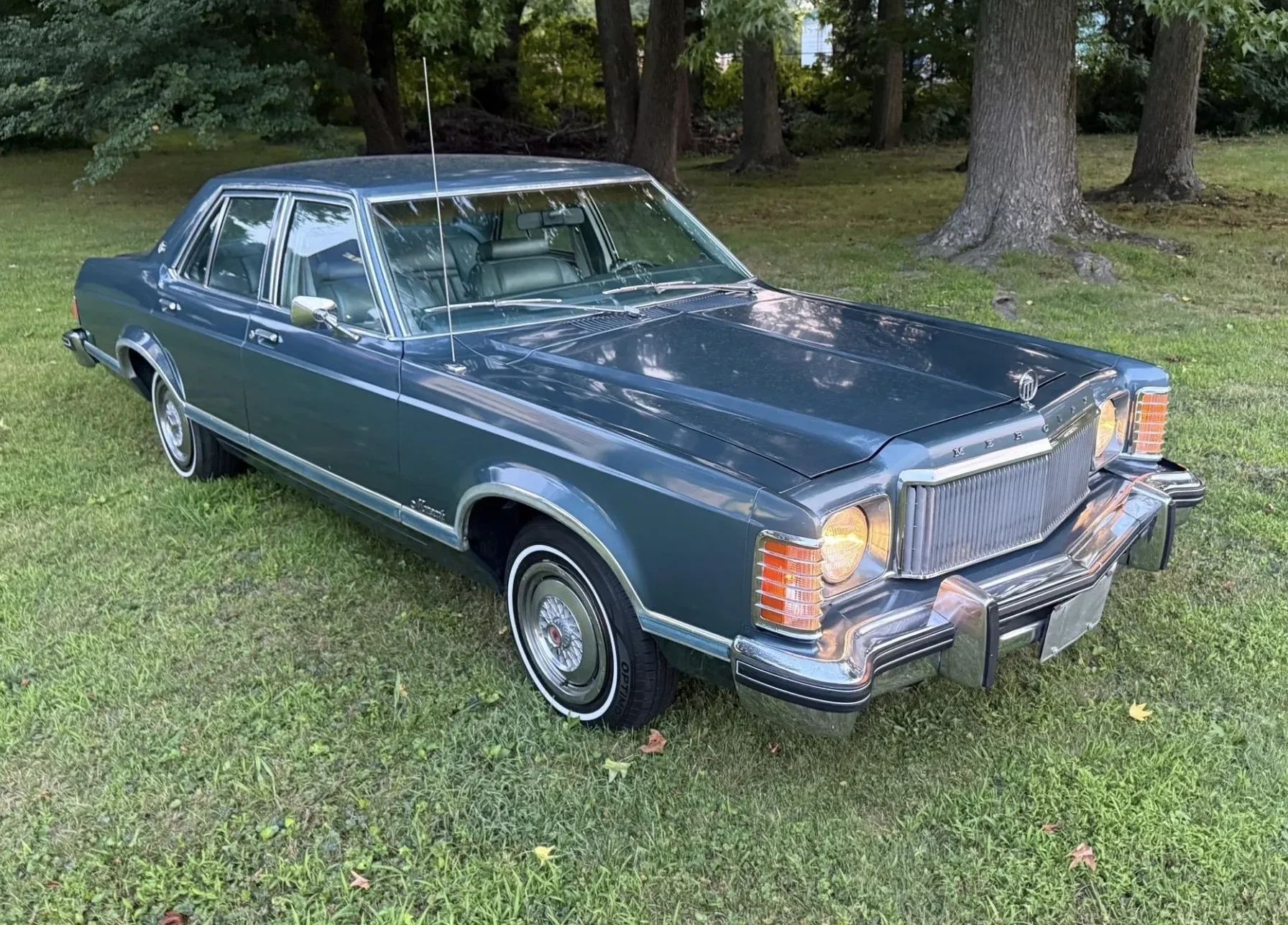 Passenger front 3q picture of blue 1976 Mercury Monarch Ghia Sedan