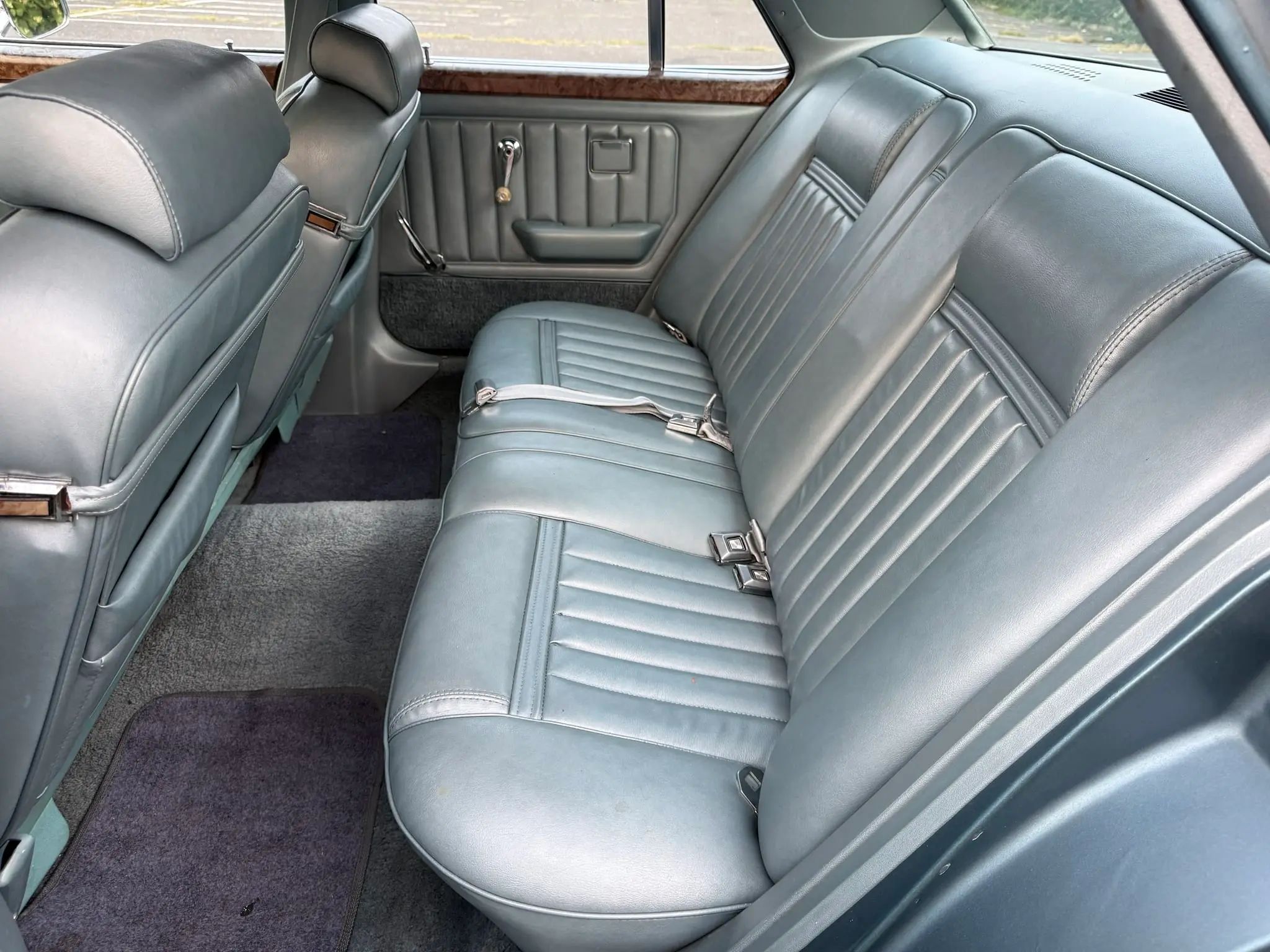 Silver rear bench seat of 1976 Mercury Monarch Ghia