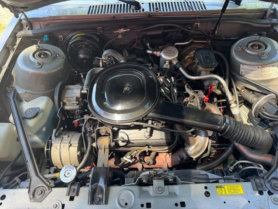 Engine compartment of 1984 Buick Skylark with 2.8-liter V6