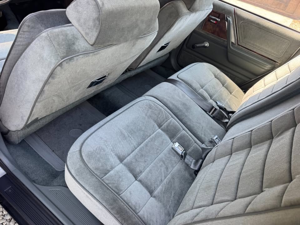 Rear seat of gray 1984 Buick Skylark Limited