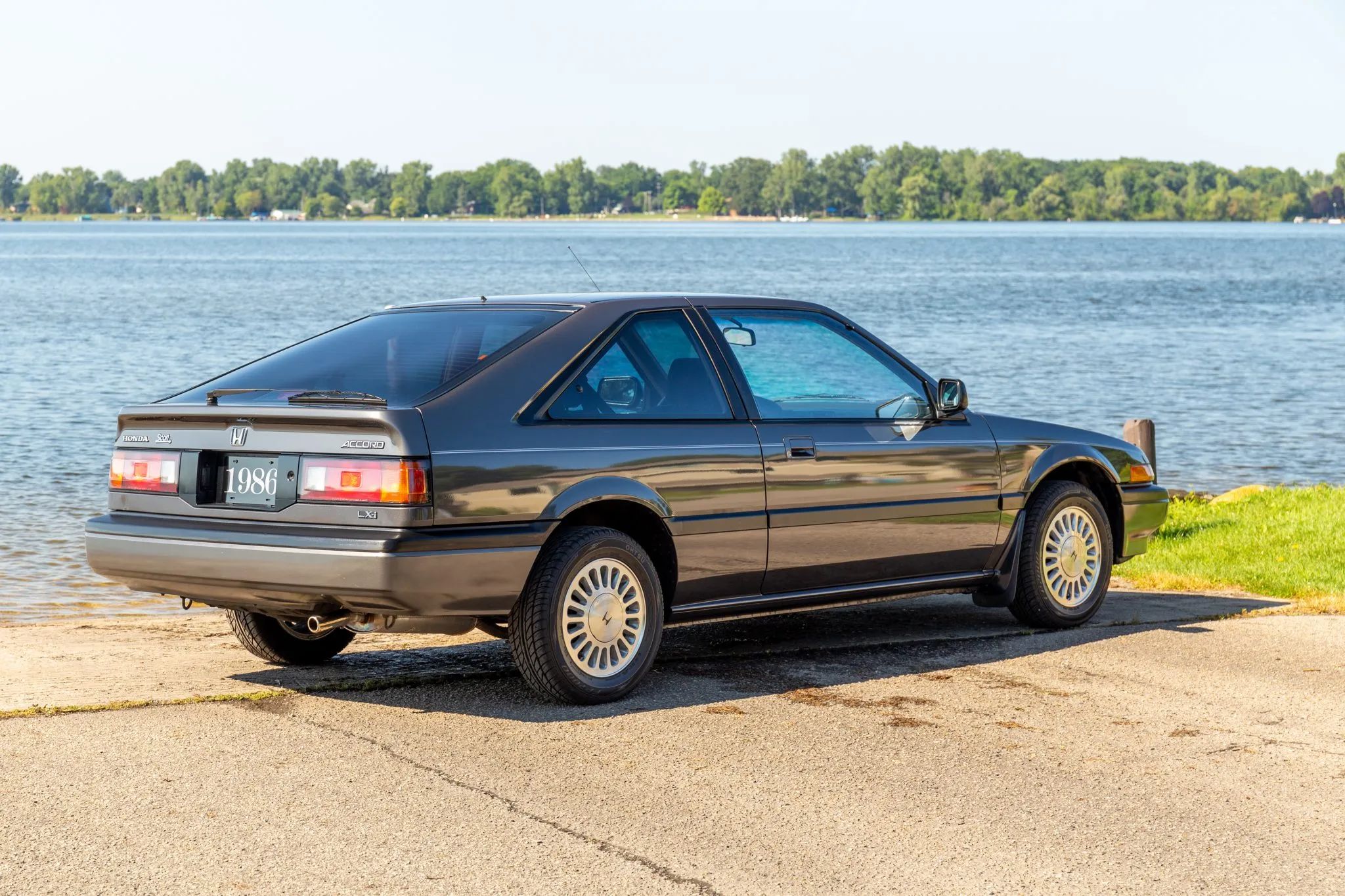 1988/1989 Honda Accord DX Coupe: It Gets My Vote For The Best-Looking Honda 3 Passenger rear 3q image of gray 1986 Honda Accord in front of a waterway