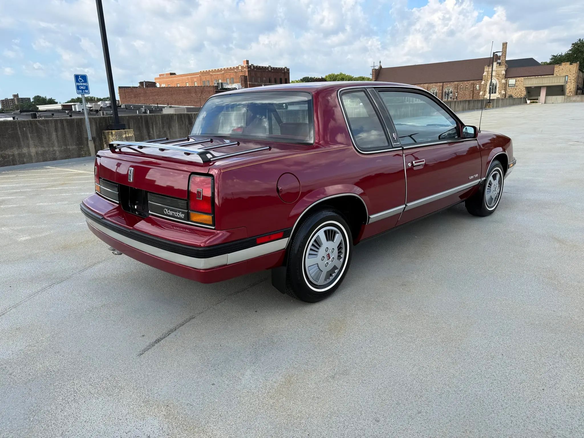 1988 Oldsmobile Cutlass Calais: A Low-Mileage Example Of A Forgotten Commuter Coupe 8 Passenger rear 3q picture of burgundy 1988 Oldsmobile Cutlass Calais Coupe