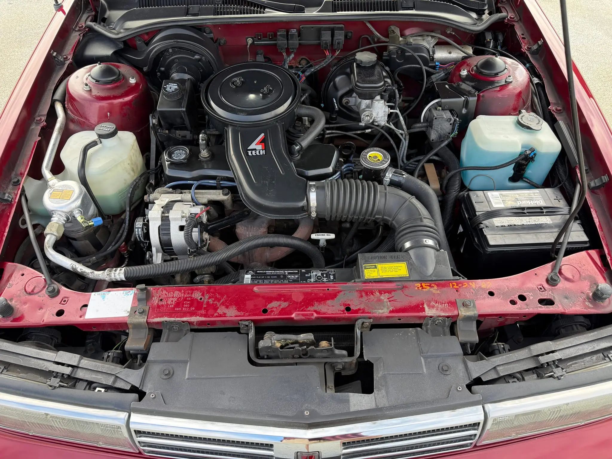 1988 Oldsmobile Cutlass Calais: A Low-Mileage Example Of A Forgotten Commuter Coupe 2 1988 Oldsmobile Cutlass Calais Coupe engine compartment with 2.5-liter Tech 4 engine