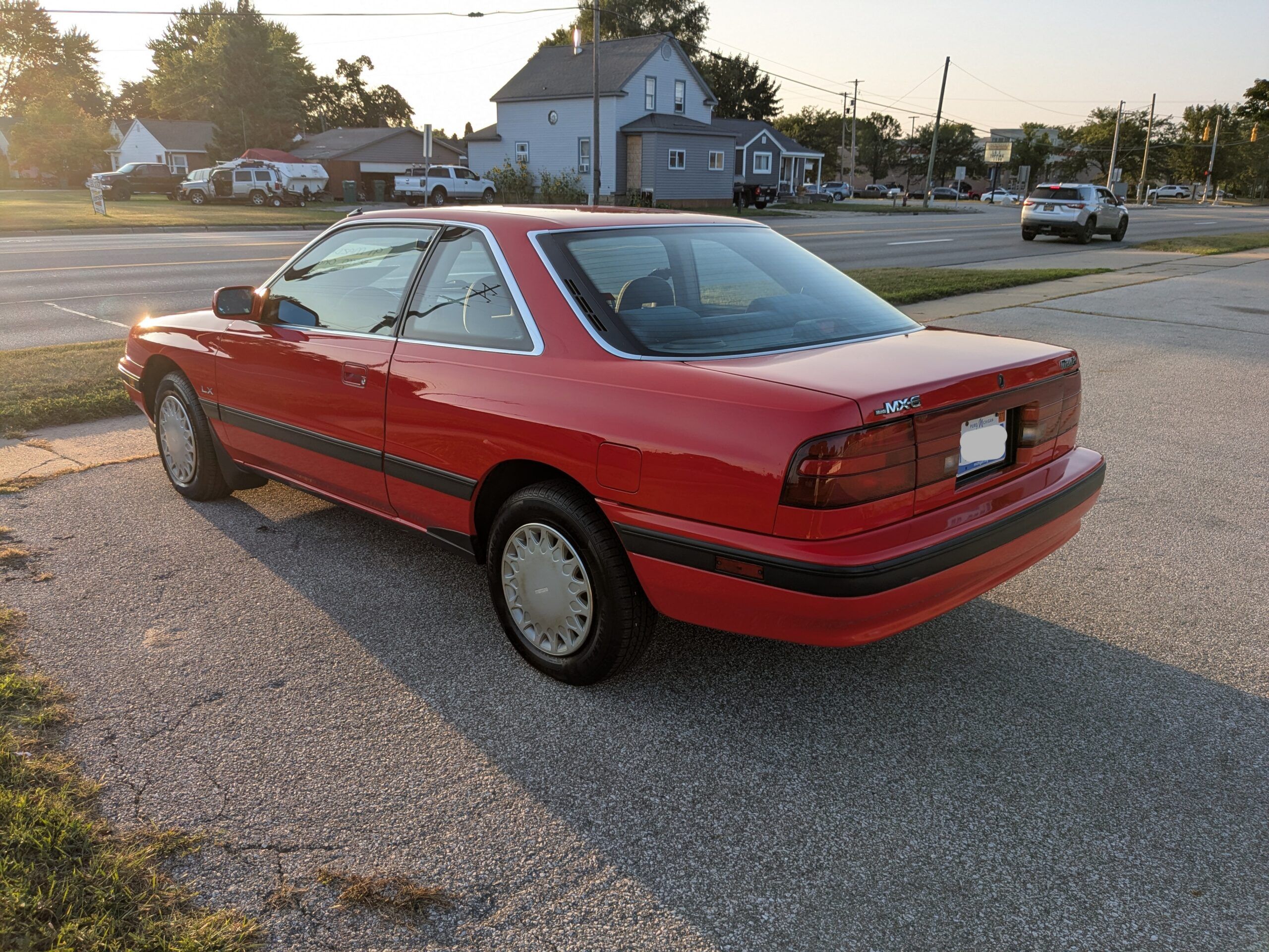1991 Mazda MX-6 LX: In An Alternate Universe, This Could Have Been The Mustang Notchback 7 Driver rear 3q image of red 1991 Mazda MX-6 LX parked in a lot