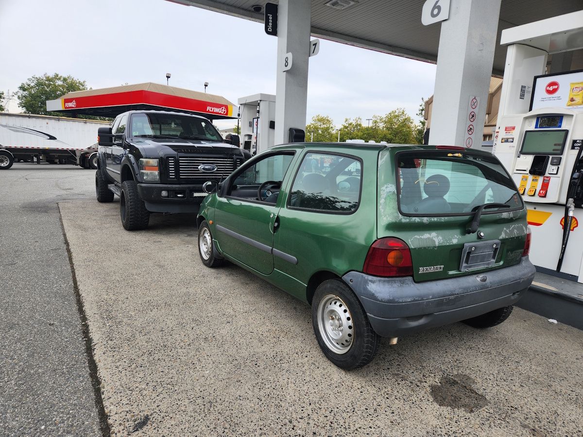 First gas up. Car at gas station. Driving The Renault Twingo Home.