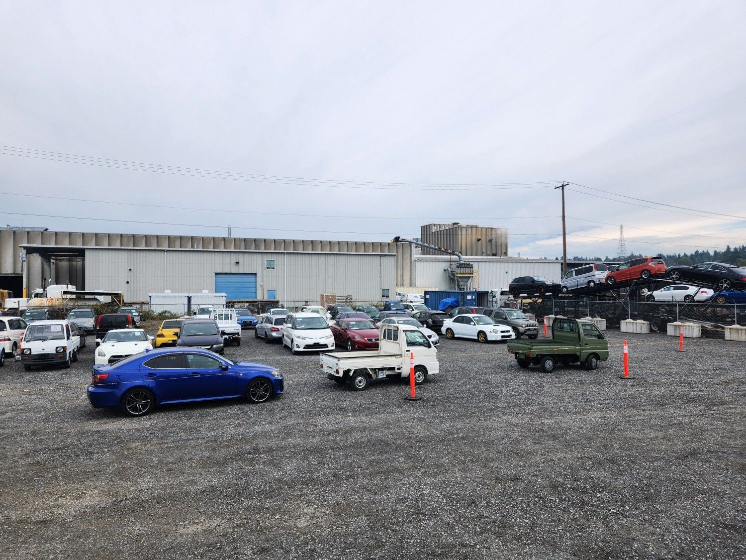 A storage yard full of JDM import cars.