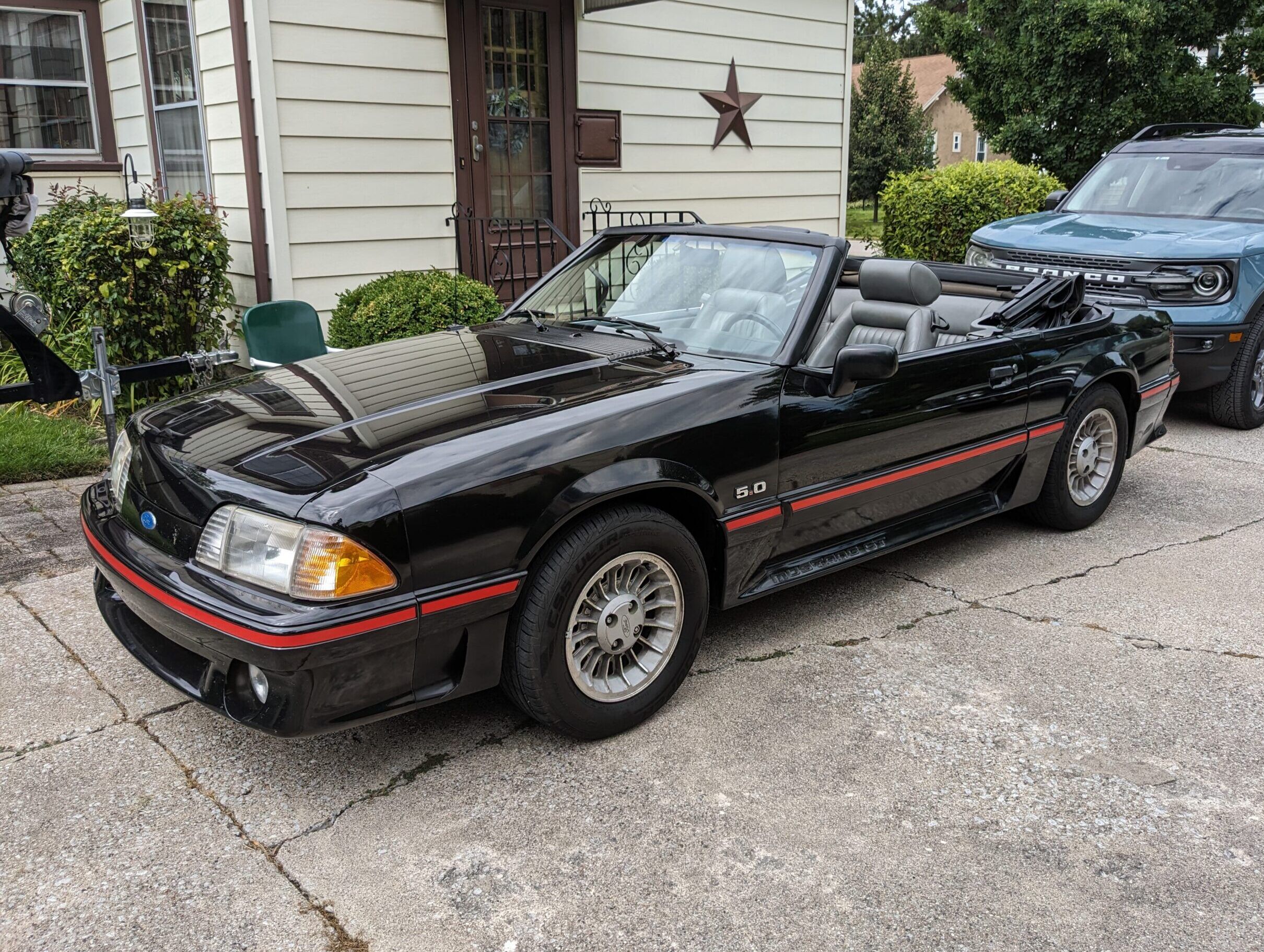 1988 Mustang GT Convertible: Why It Took Over Two Hours To Replace The Speedometer Cable 1 Driver front 3q view of black 1988 Mustang GT Convertible with red stripes
