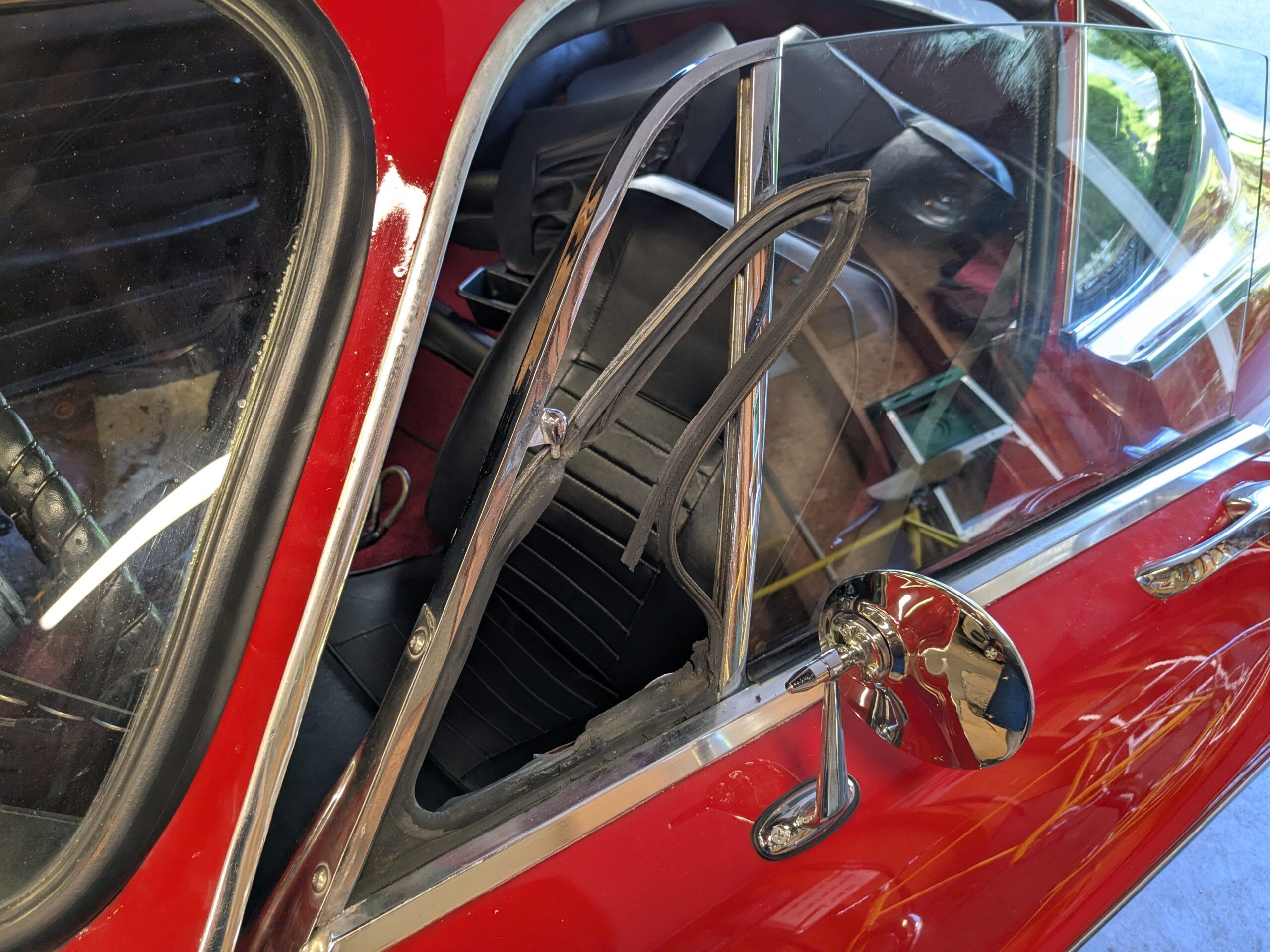 My 1967 Volvo 1800S: A Year After Its Purchase, I No Longer Completely Regret It 7 Driver vent window on red 1967 Volvo 1800S