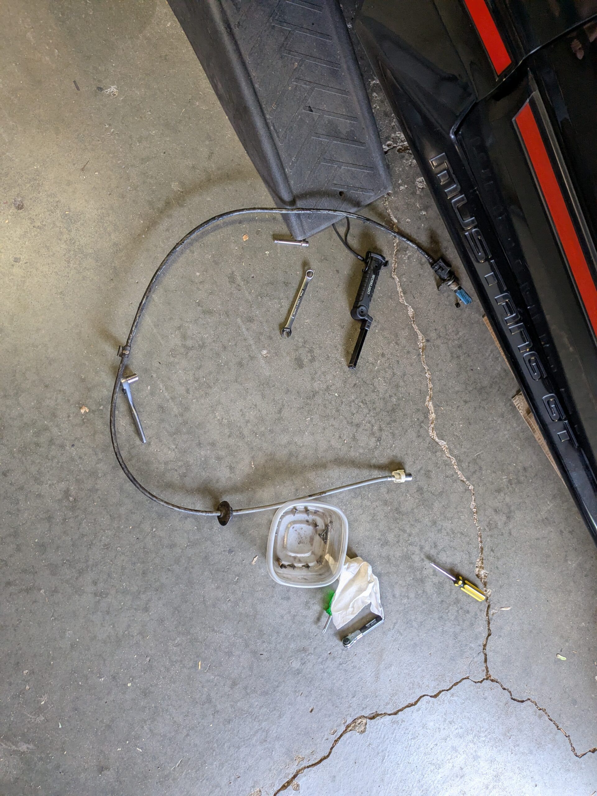 1988 Mustang GT Convertible: Why It Took Over Two Hours To Replace The Speedometer Cable 13 Old Speedometer cable, removed and lying on the garage floor