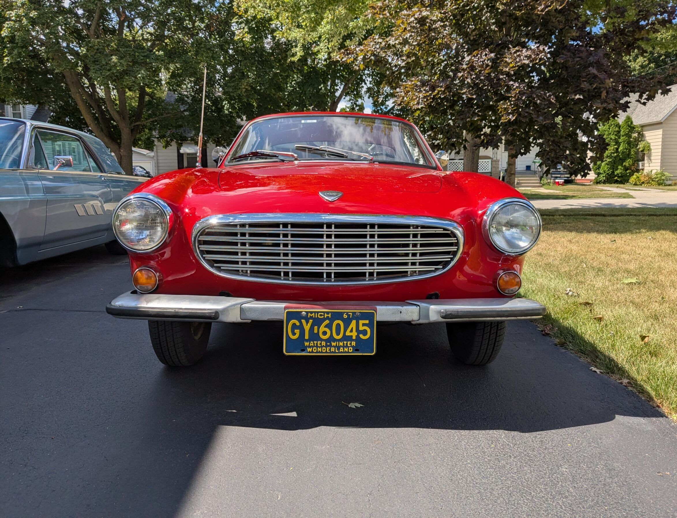 My 1967 Volvo 1800S: A Year After Its Purchase, I No Longer Completely Regret It 14 Front view of red 1967 Volvo 1800S in a residential driveway