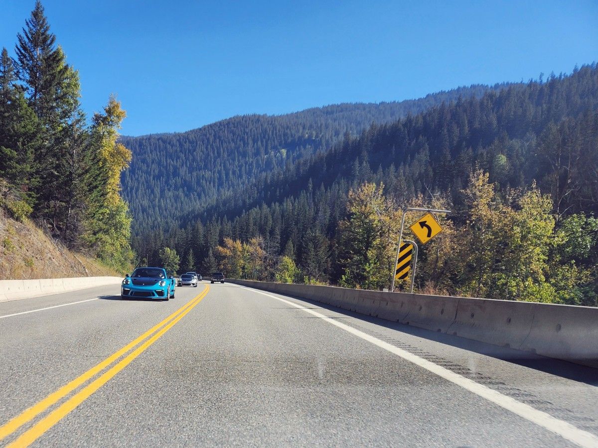 Porsches on a road.
