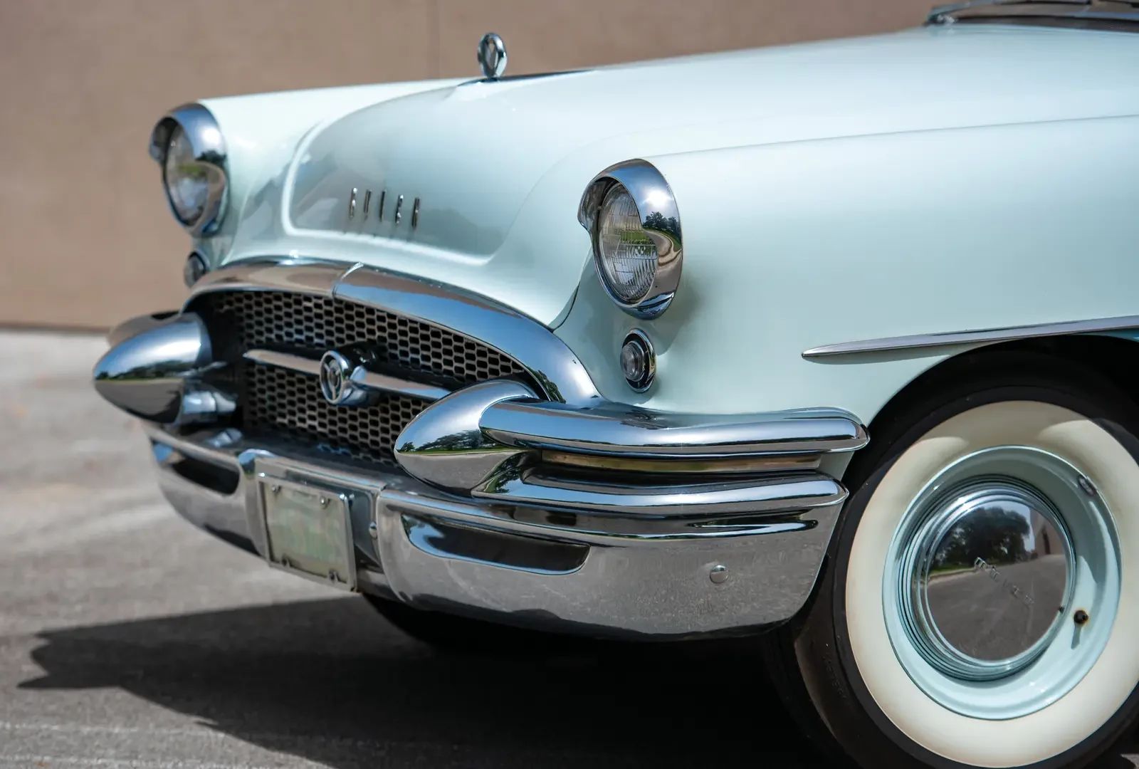 Front end of a light blue 1955 Buick