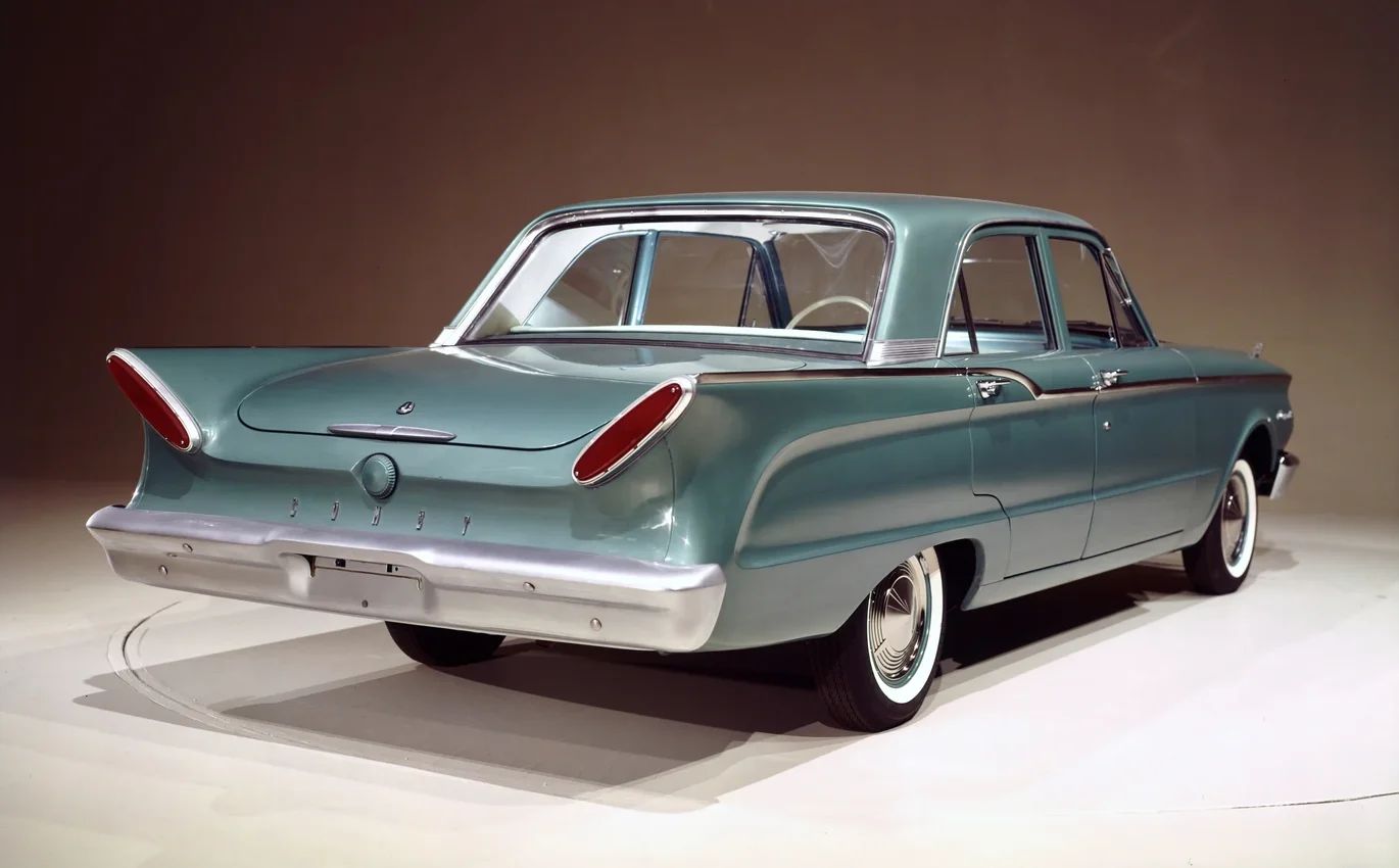 1963 Mercury Comet V-8 Sedan: "For Better Or For Worse, Something Different Under The Hood" 3 Studio shot showing the right rear 3q view of a 1960 Comet four-door