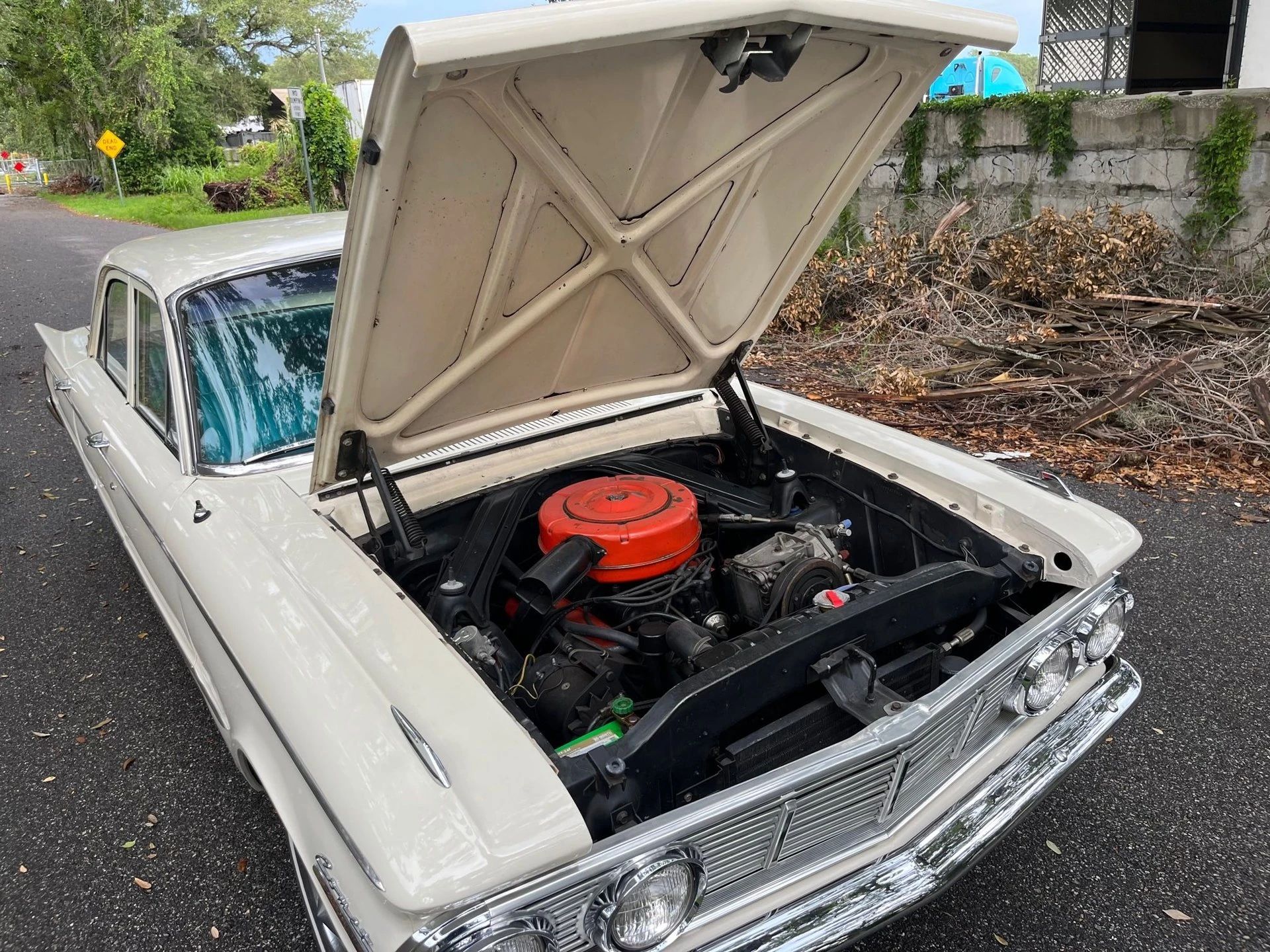 1963 Mercury Comet V-8 Sedan: "For Better Or For Worse, Something Different Under The Hood" 6 1963 Comet four-door sedan with its hood open to reveal the V-8 engine
