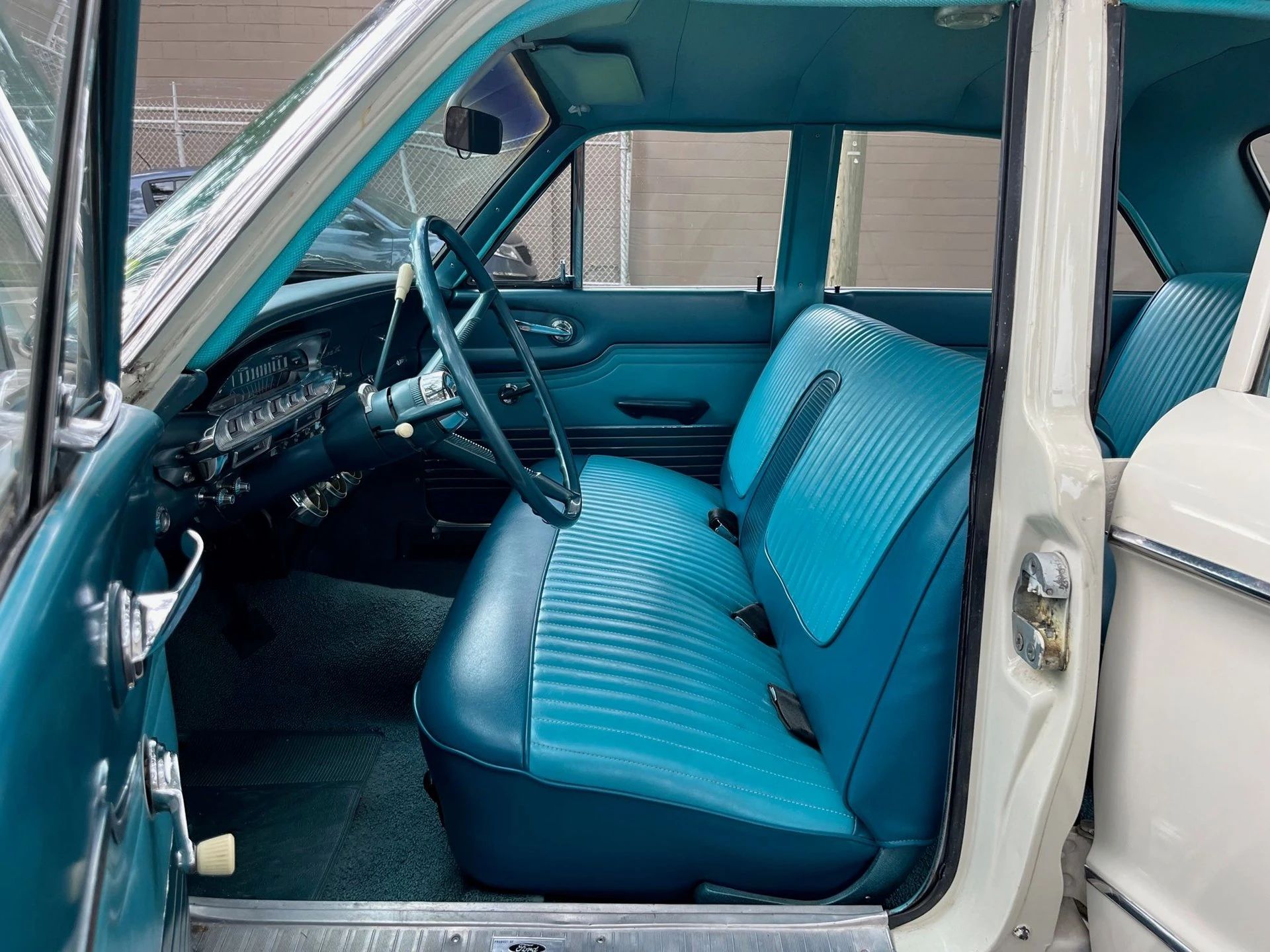 1963 Mercury Comet V-8 Sedan: "For Better Or For Worse, Something Different Under The Hood" 17 Front bench seat of a 1963 Comet four-door sedan, seen through the driver's door