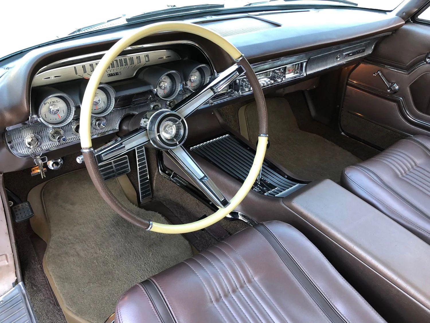 1963 Mercury Monterey S-55 Two-Door Hardtop: One-Year-Only Bucket-Seat Breezeway 25 Steering wheel and dashboard in a 1963 Mercury with bucket seats, seen from the left