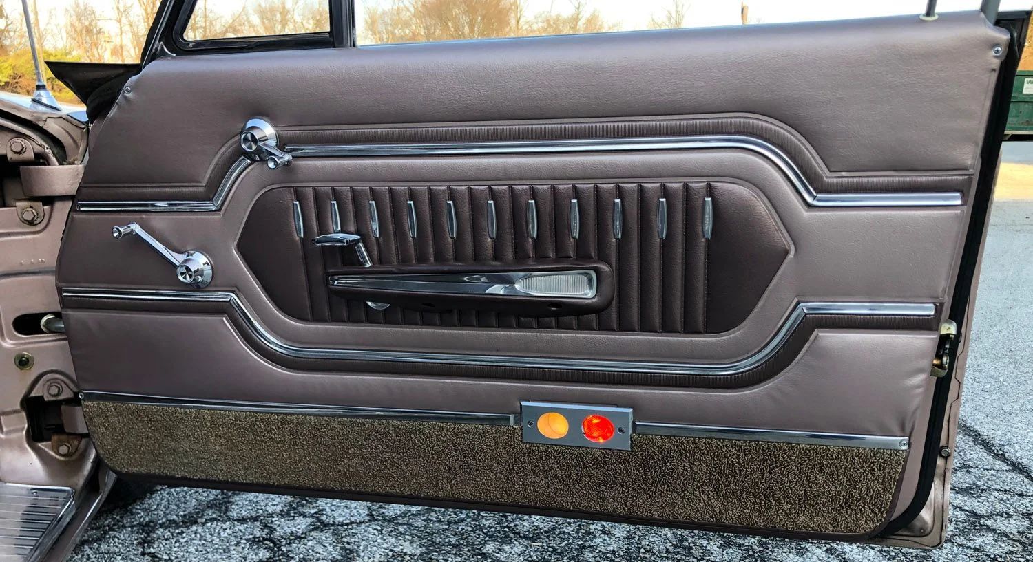 1963 Mercury Monterey S-55 Two-Door Hardtop: One-Year-Only Bucket-Seat Breezeway 22 Passenger door trim of a 1963 Mercury with round white and red courtesy lamps