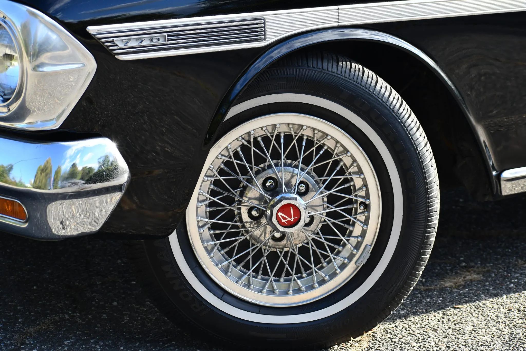 1964 Rambler Classic 770 V-8 Hardtop With Bucket Seats: Somebody's Idea Of The Perfect Rambler 11 Wire wheel and whitewall tire on a black Rambler
