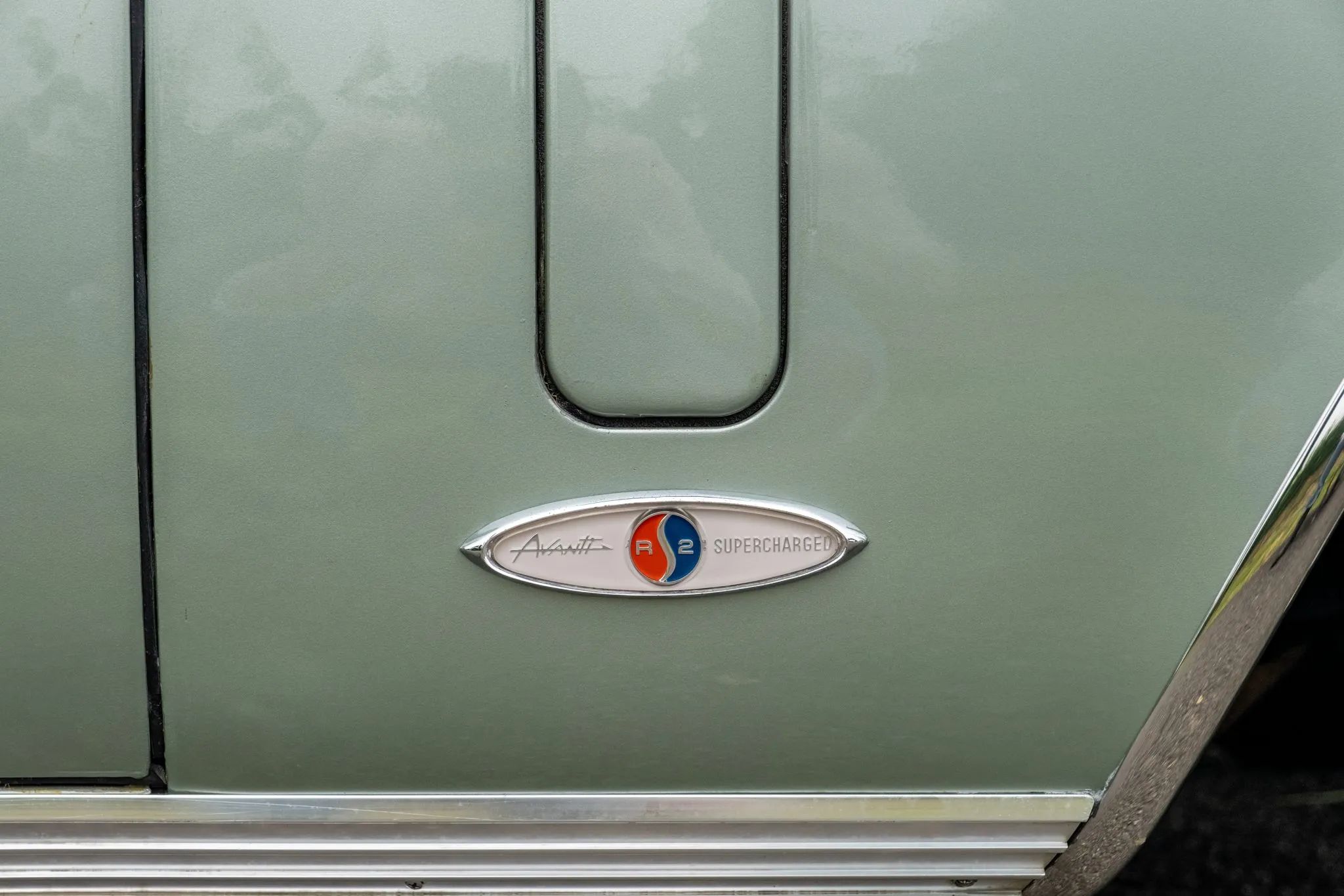 1964 Studebaker GT Hawk: One Of Only 70 Final-Year Hawks With The R2 Supercharged Engine 12 Avanti R2 Supercharged badge on a 1964 Hawk, below the ventilation door