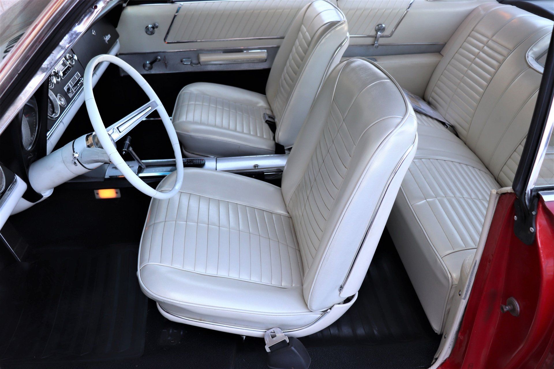 1966 Oldsmobile Starfire: The Last Full-Size Starfire, Lost In the Shadow Of The Toronado 15 Bucket seats and center console in a 1966 Oldsmobile, seen from the driver's door