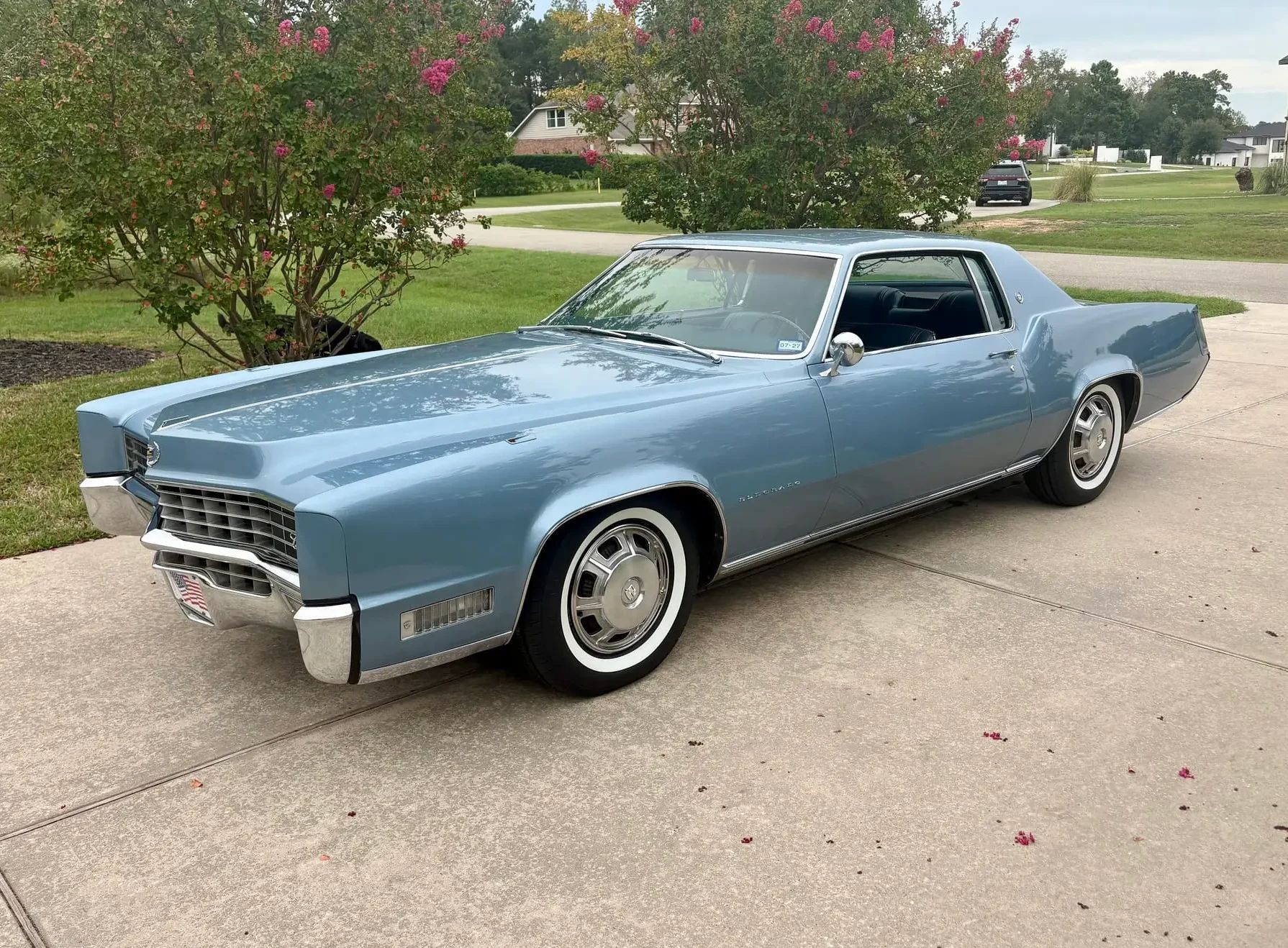 Riviera, Thunderbird, Eldorado, Toronado, Or GT Hawk: Which 1960s Personal Luxury Coupe Is *Your* Favorite? 4 Driver front 3q picture of blue 1967 Cadillac Eldorado parked in a driveway