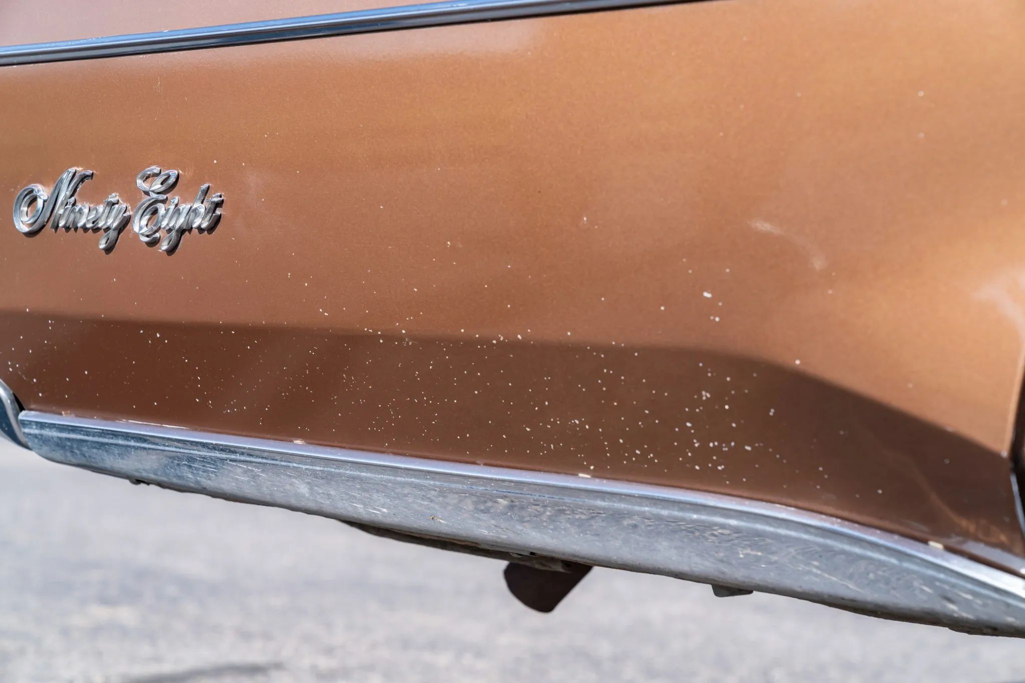 1972 Oldsmobile Ninety-Eight Luxury Sedan: A Full-Size Luxury Bargain From Big Sky Country 23 Right rear fender of a 1972 Oldsmobile, with the paint covered with many small pock marks