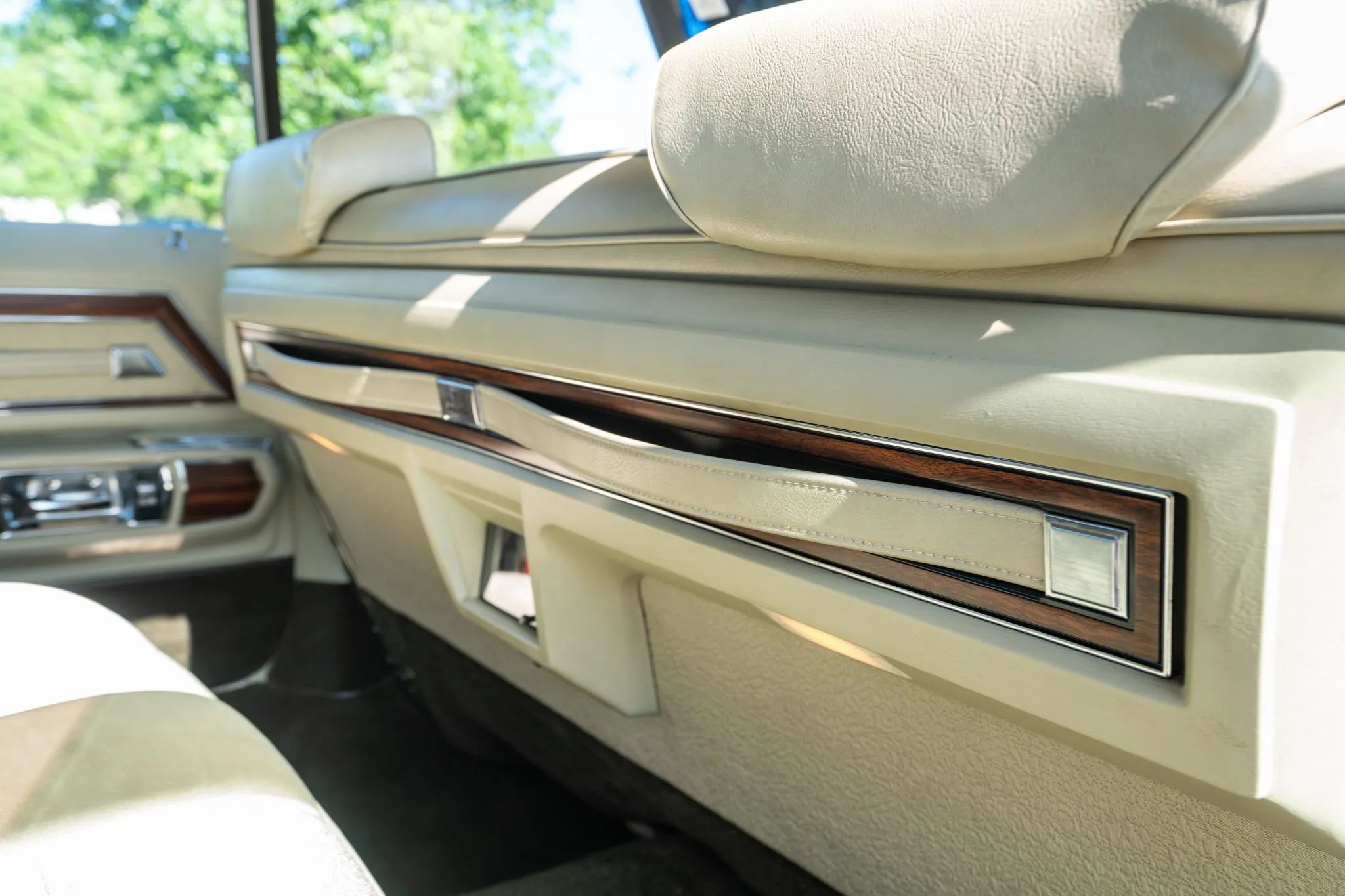 1972 Oldsmobile Ninety-Eight Luxury Sedan: A Full-Size Luxury Bargain From Big Sky Country 21 Front seatback of a 1972 Oldsmobile with two vinyl assist straps in a panel of simulated wood
