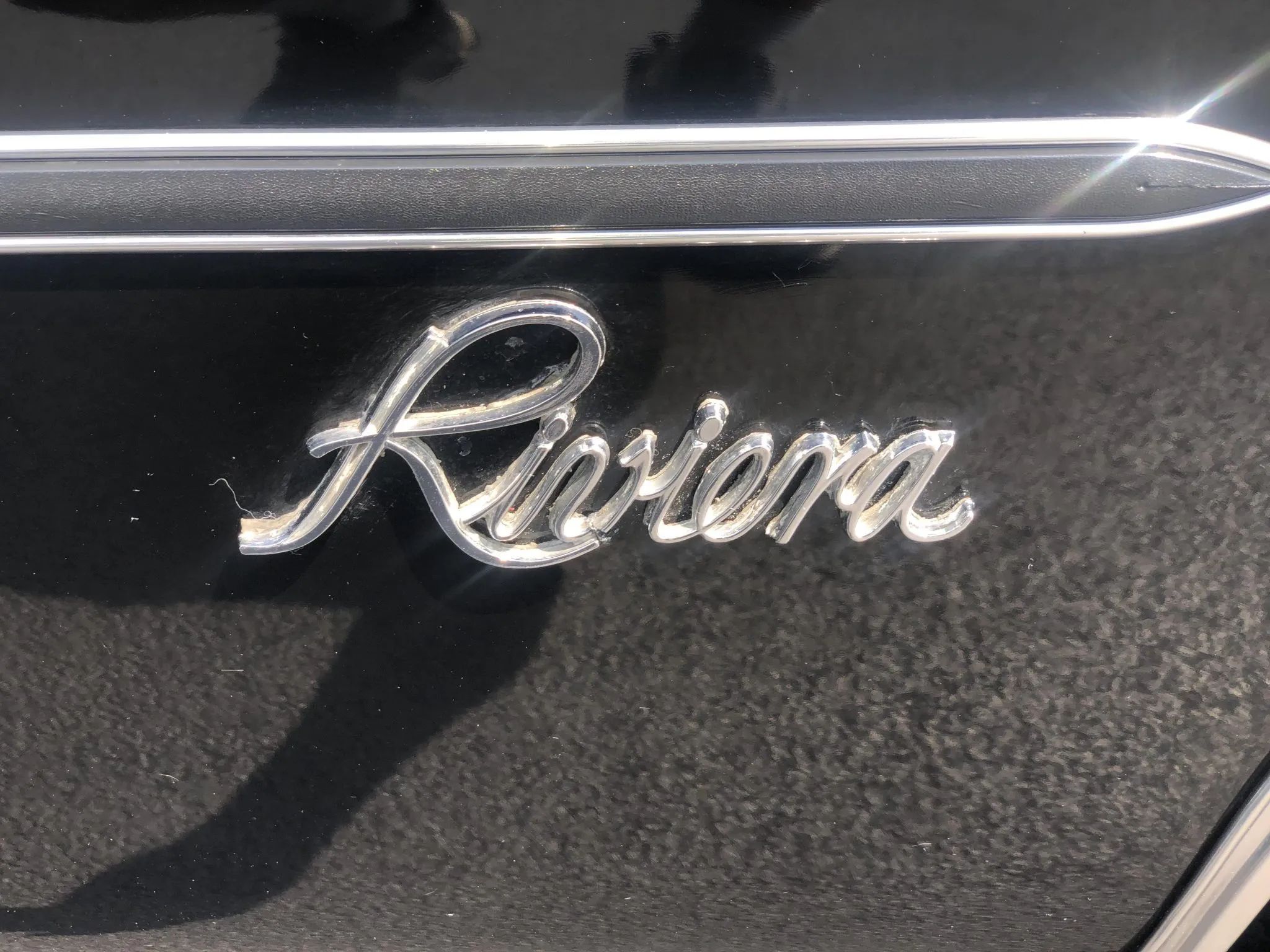 Vintage Review: 1976 Buick Riviera – "Once Big, Flashy, Fast And Unique, It Is Now Simply Big" 2 Riviera badge on a black car