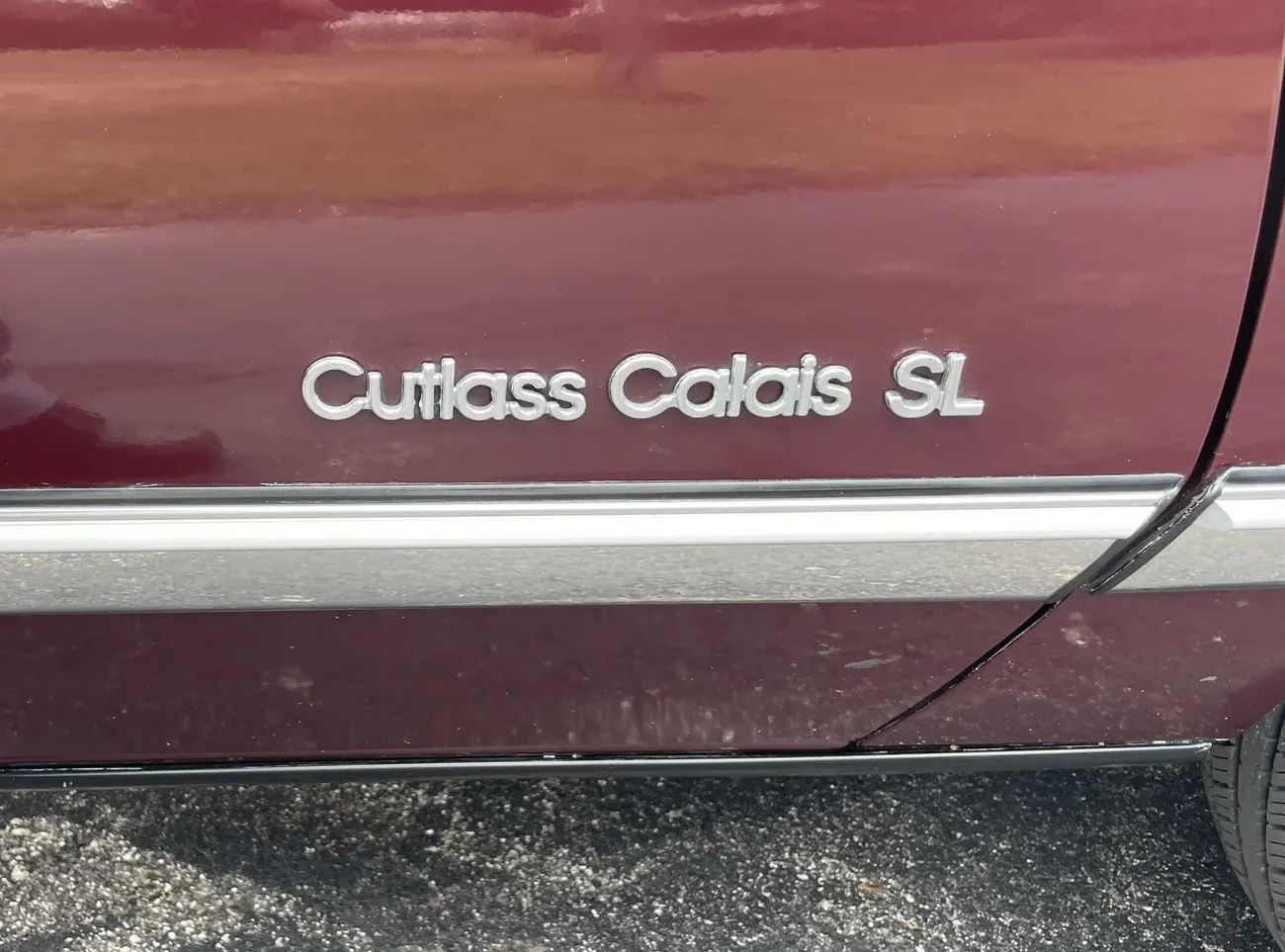 1988 Oldsmobile Cutlass Calais With Quad 4 And Rare 5-Speed: "A Heady Blend of High Revs and Haut Velour" 9 Cutlass Calais SL badge on the fender of a 1988 N-body