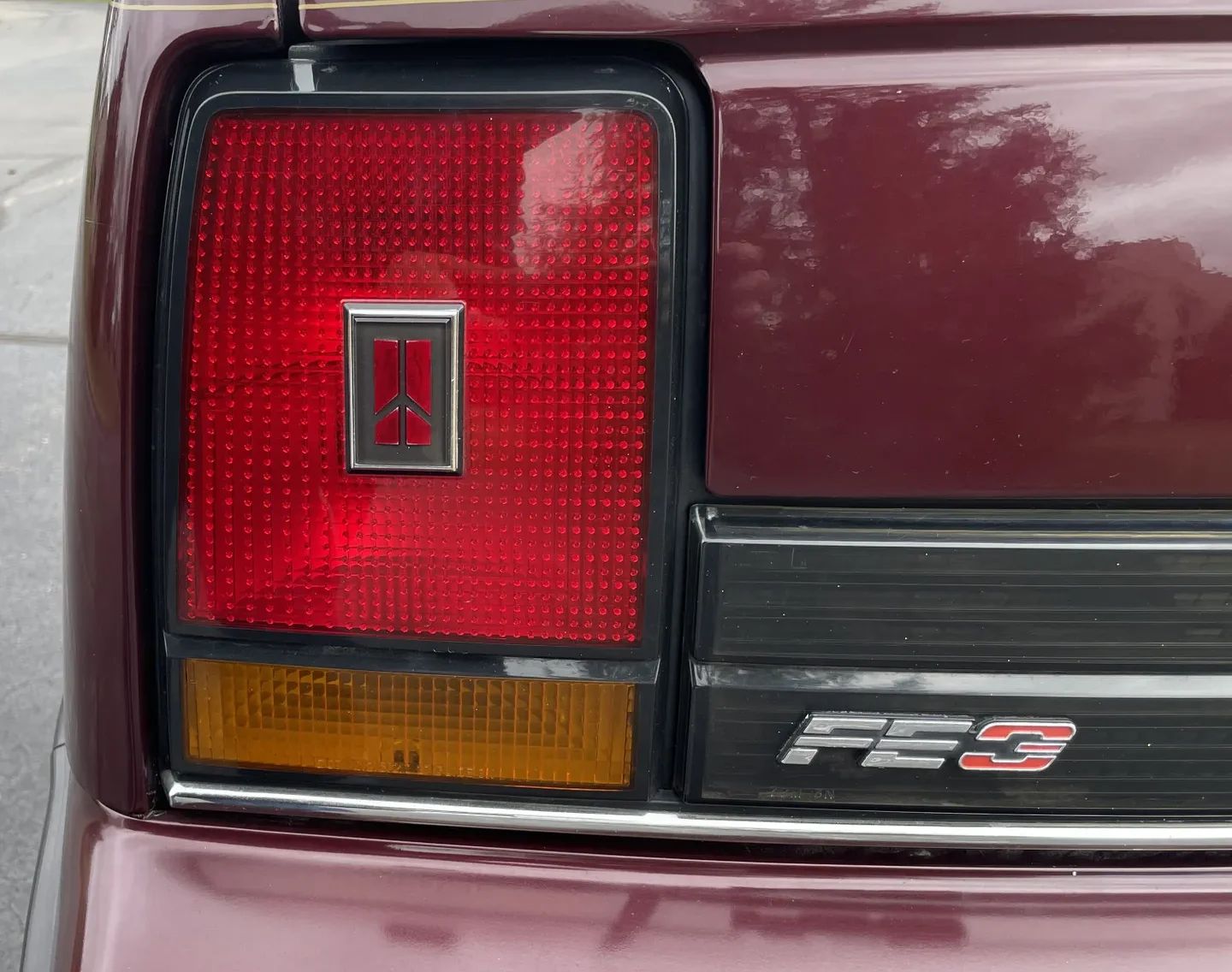 1988 Oldsmobile Cutlass Calais With Quad 4 And Rare 5-Speed: "A Heady Blend of High Revs and Haut Velour" 13 Left taillight and FE3 badge on a 1988 Oldsmobile N-body Calais