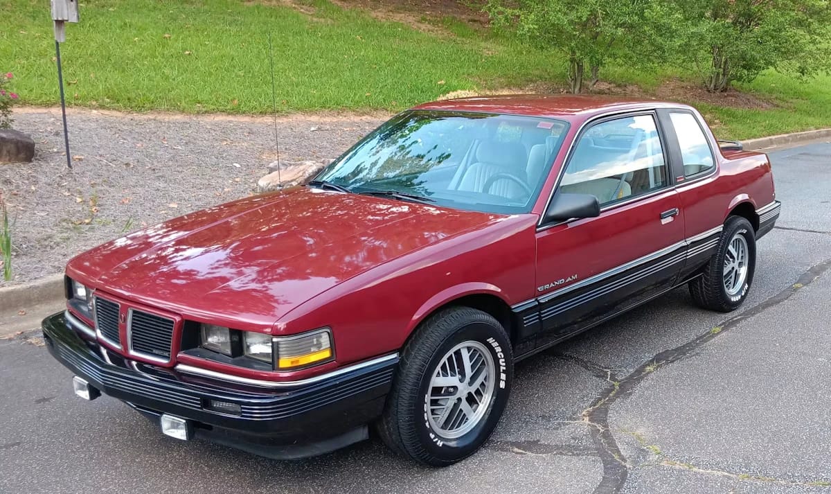 1988 Oldsmobile Cutlass Calais With Quad 4 And Rare 5-Speed: "A Heady Blend of High Revs and Haut Velour" 22 Left front 3q view of a 1988 Pontiac Grand Am with aftermarket foglights