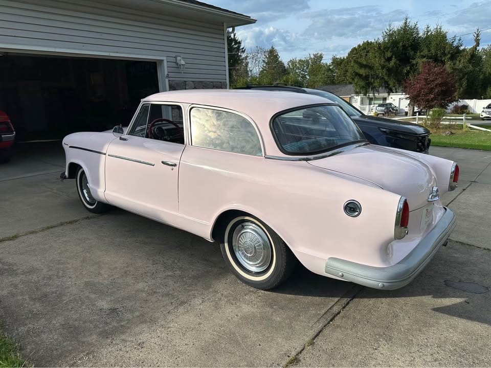 1960 Rambler American Super: A Cute And Fairly Inexpensive Way To Draw Attention 6 Driver rear 3q picture of pink 1960 Rambler American Super parked in a driveway