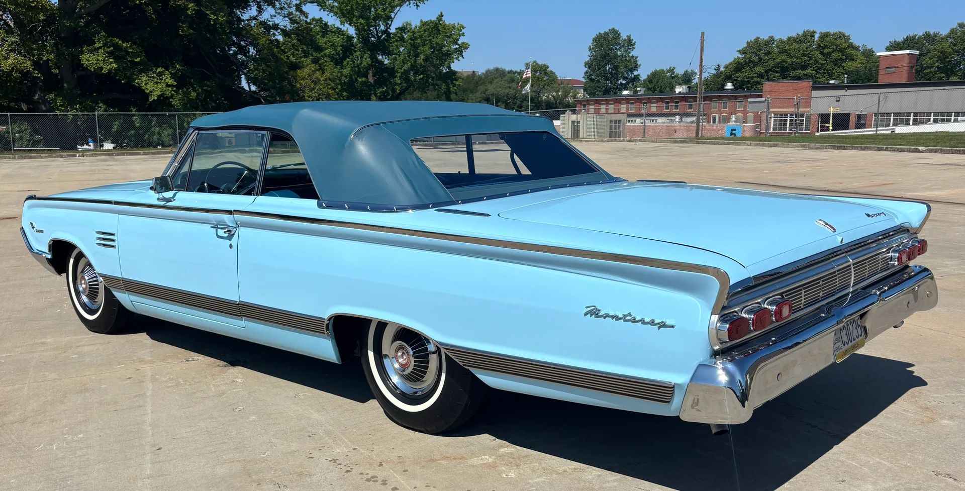 Driver rear 3q picture of blue 1964 Mercury Monterey Convertible with blue convertible top