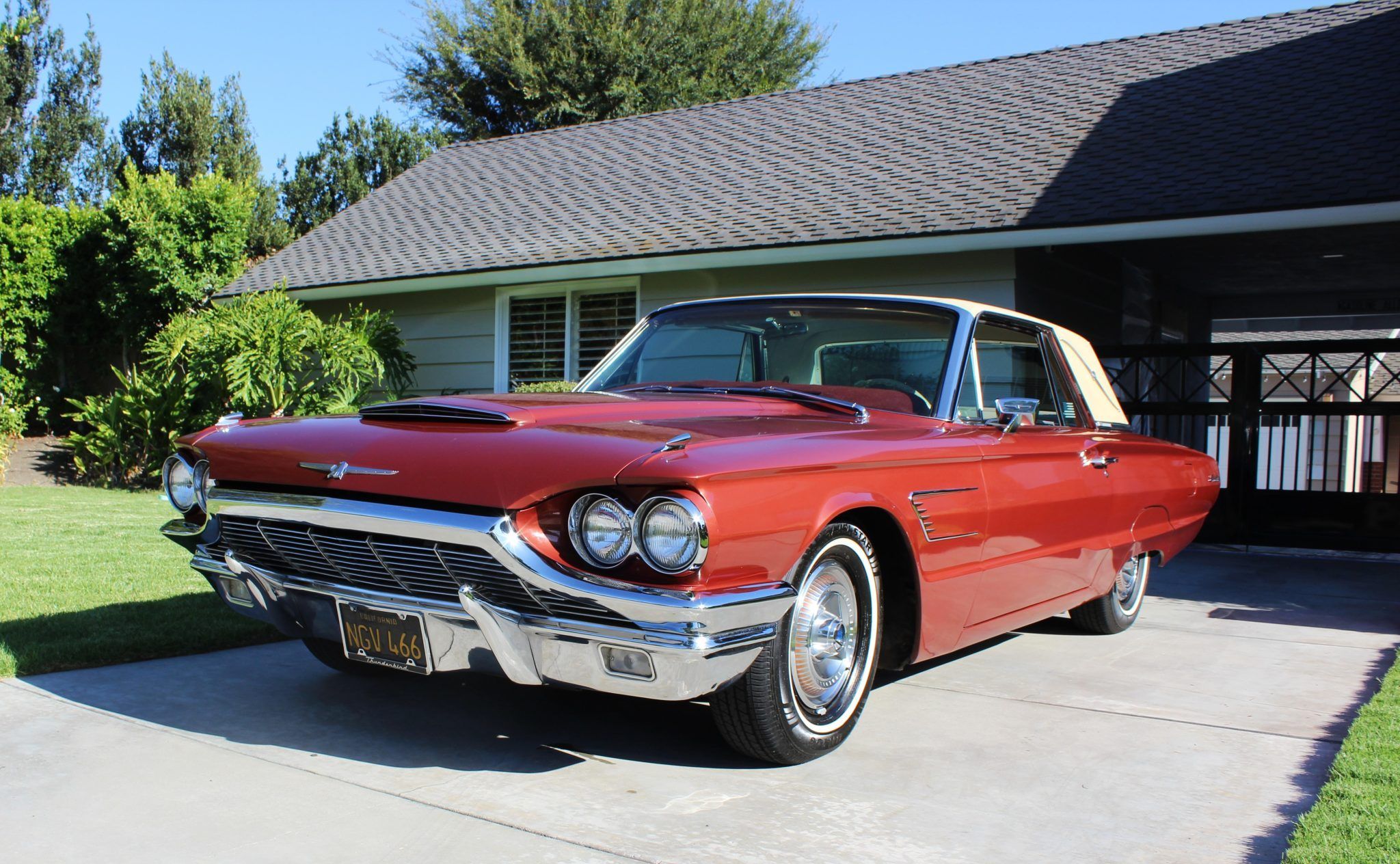 Riviera, Thunderbird, Eldorado, Toronado, Or GT Hawk: Which 1960s Personal Luxury Coupe Is *Your* Favorite? 7 Driver front 3q image of copper 1965 Ford Thunderbird with tan vinyl top parked in a driveway in front of a house