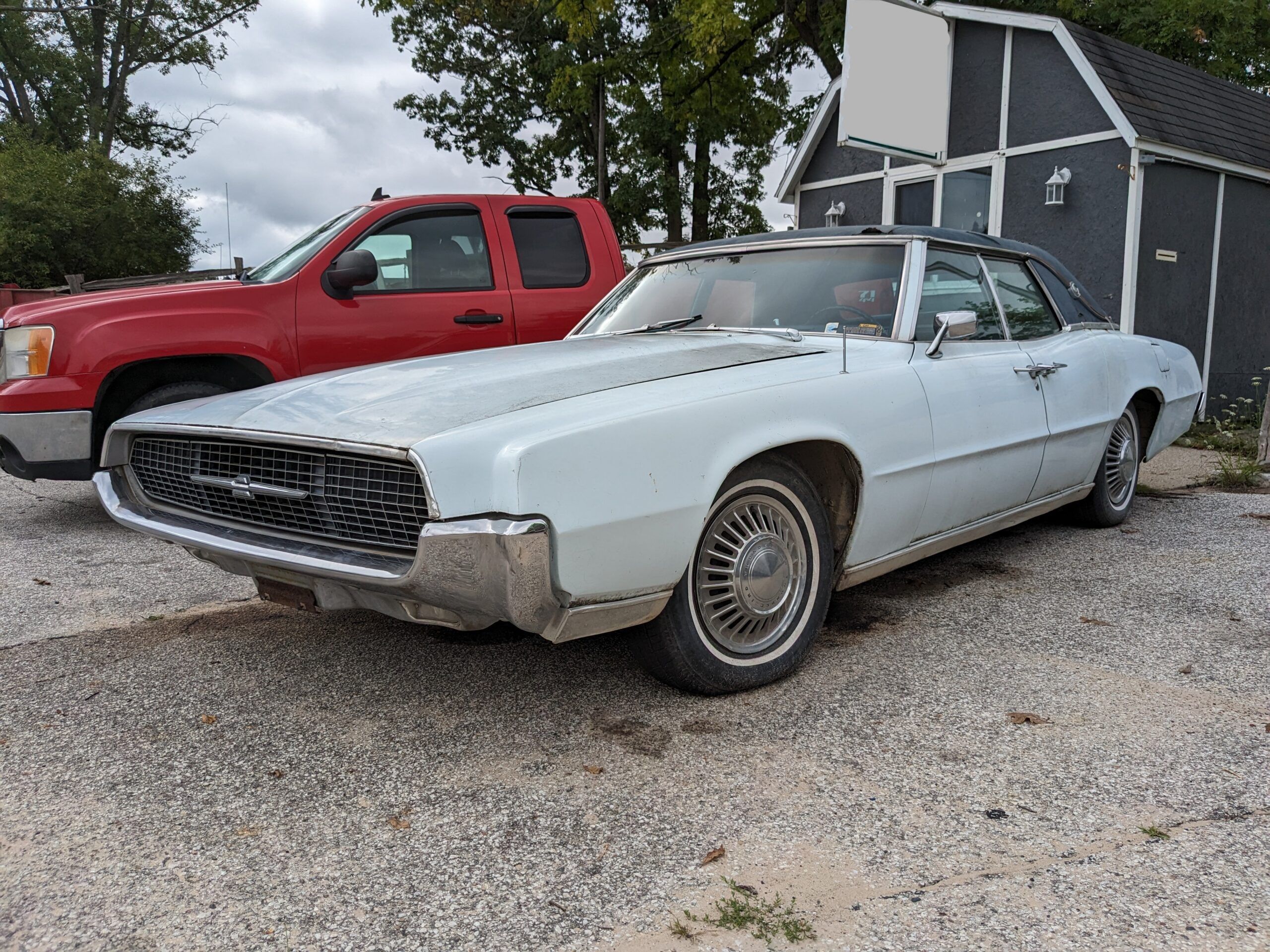 Riviera, Thunderbird, Eldorado, Toronado, Or GT Hawk: Which 1960s Personal Luxury Coupe Is *Your* Favorite? 8 Driver front 3q picture of light blue 1967 Ford Thunderbird four-door Landau