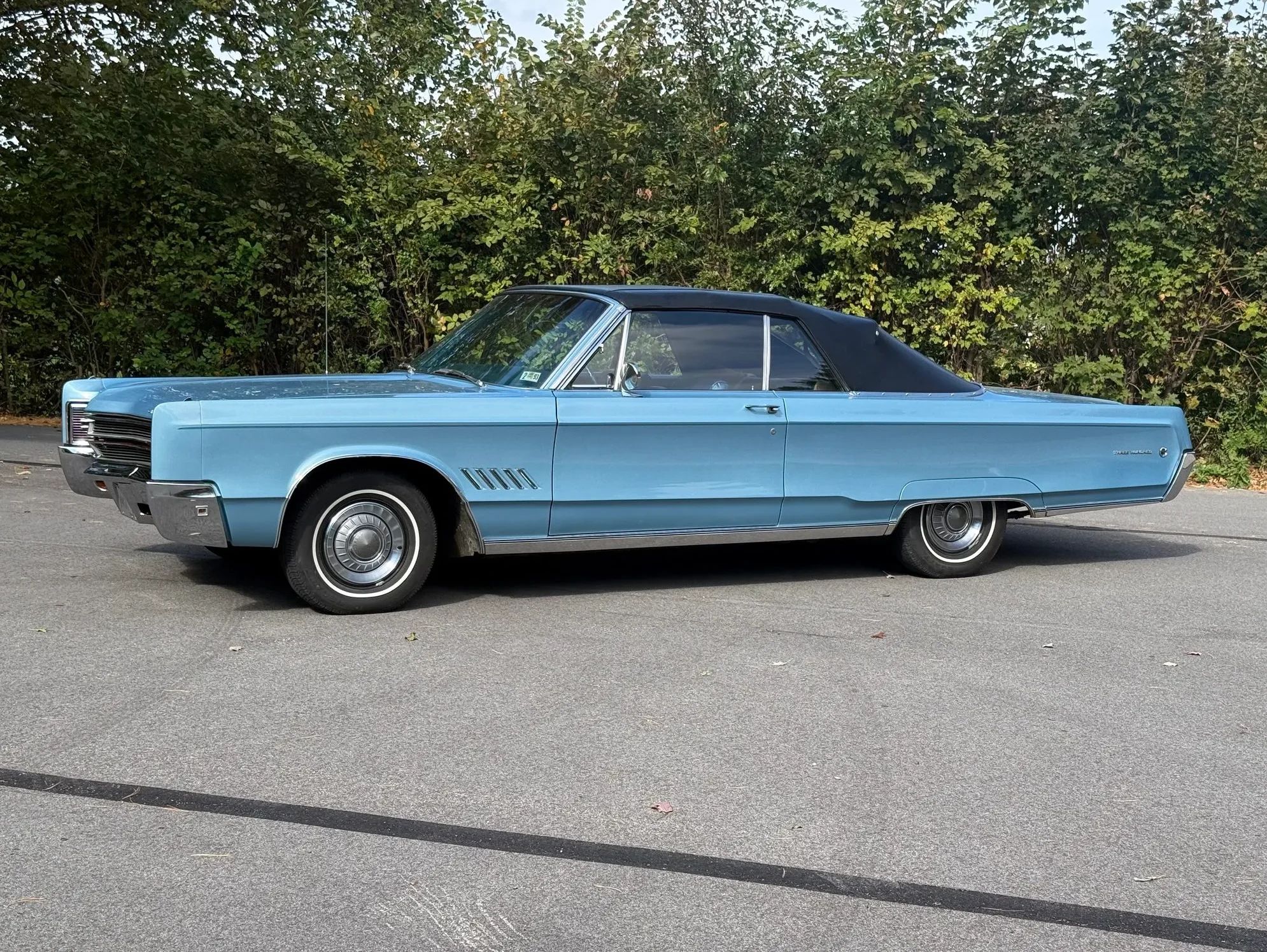 1968 Chrysler 300 Convertible: The Last Stop Before The Fuselage Chrysler 7 Driver side view of blue 1968 Chrysler 300 Convertible parked in a lot in front of trees