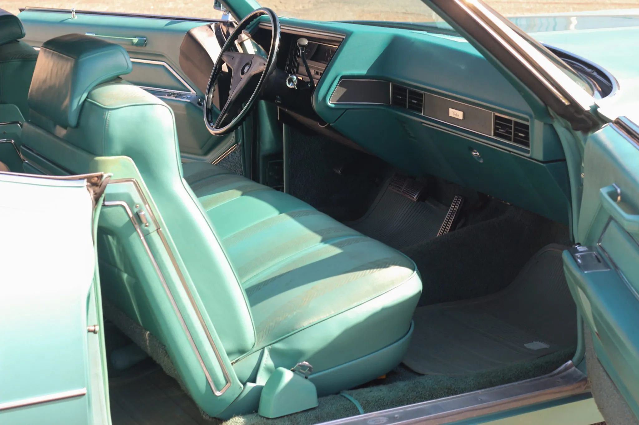 1970 Cadillac Calais Coupe interior in turquoise cloth and vinyl
