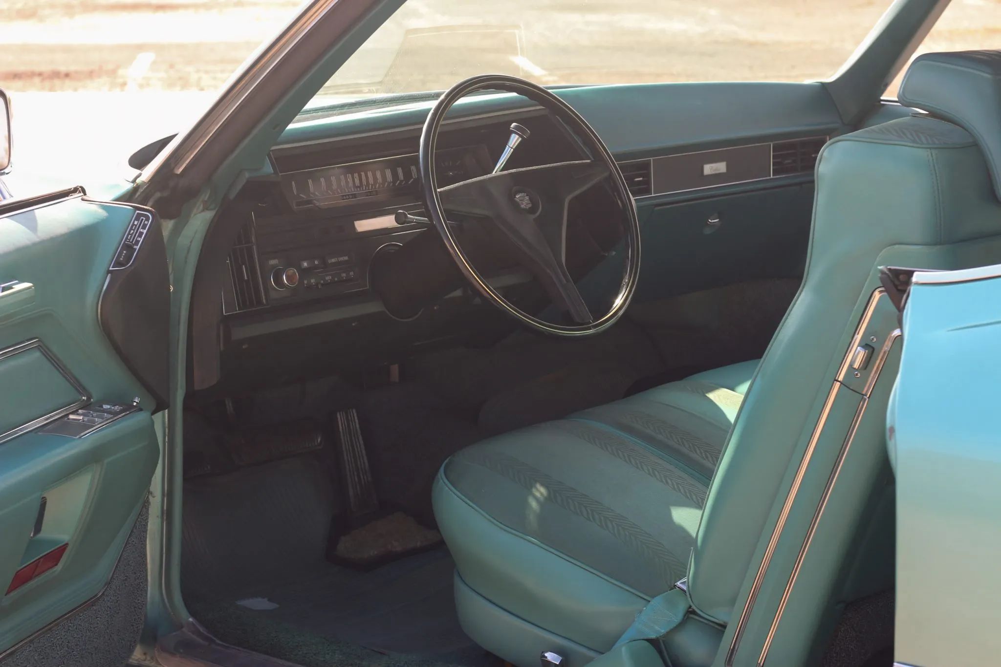 1970 Cadillac Calais interior in turquoise cloth and vinyl