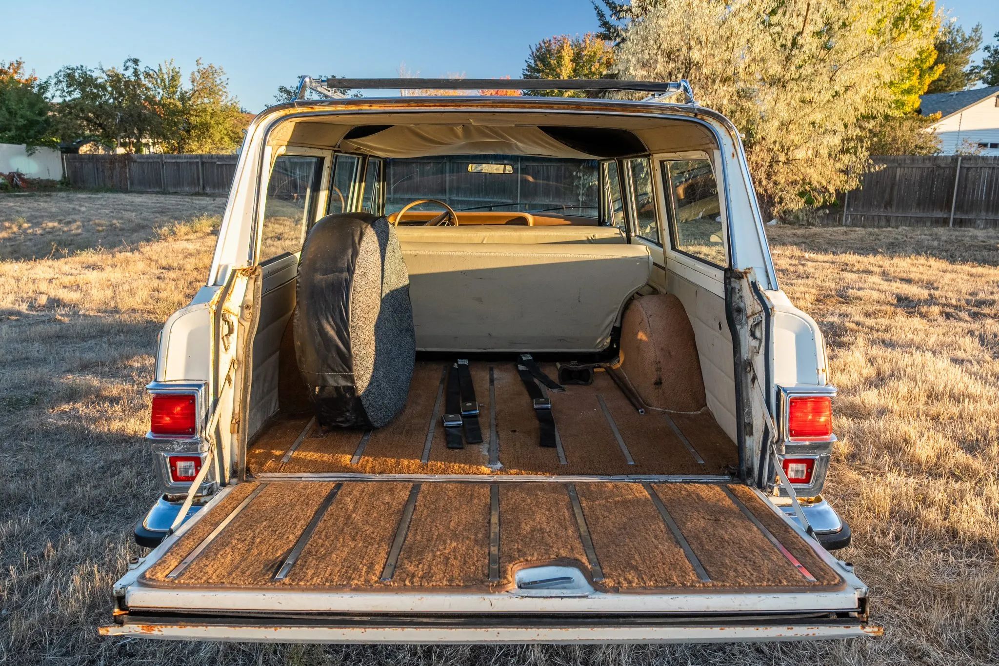 1975 Jeep Wagoneer Custom: A 401-Powered, No-Reserve Example Of America's Greatest Automotive Industrial Design 5 Luggage area of white 1975 Jeep Wagoneer Custom with tailgate open