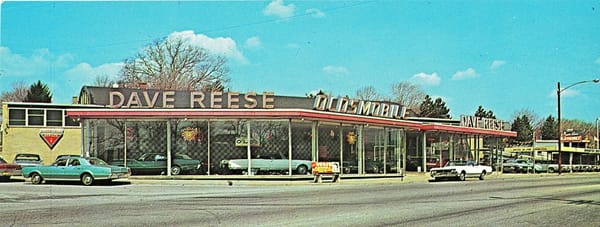 Scanned color photo of Dave Reese Oldsmobile dealership