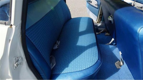 Vintage R&T Review: 1960 Valiant — A Technical Analysis Of Chrysler's New Compact 6 Back seat of a 1960 Valiant V200 sedan with blue interior, seen through the right rear door