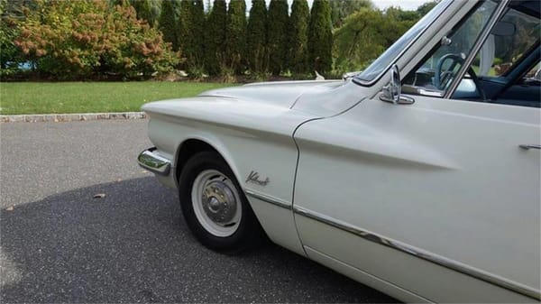 Vintage R&T Review: 1960 Valiant — A Technical Analysis Of Chrysler's New Compact 11 Left front fender of a white 1960 Valiant V200 sedan